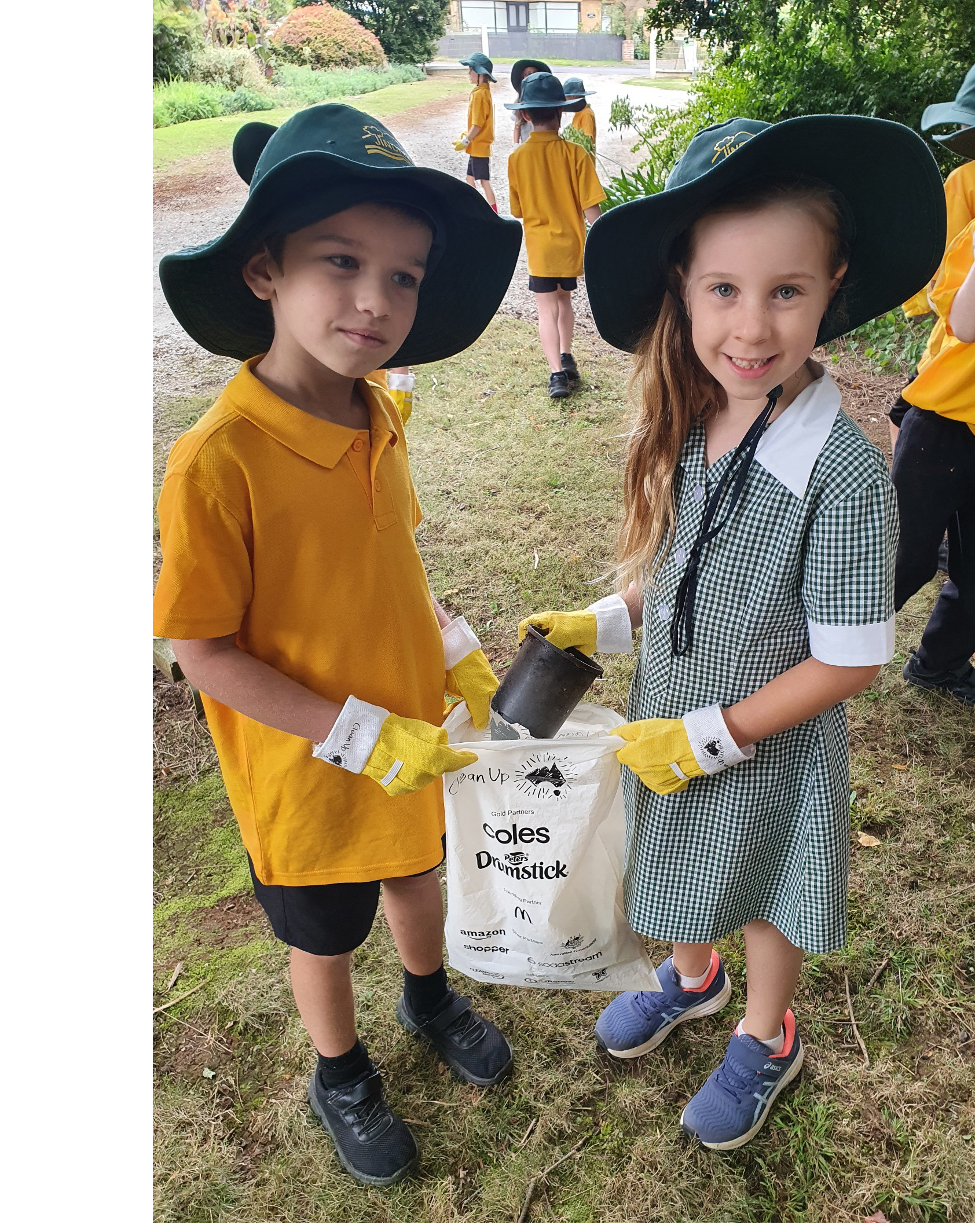 Mathew Vincent and Evie Burridge helping with the clean-up.