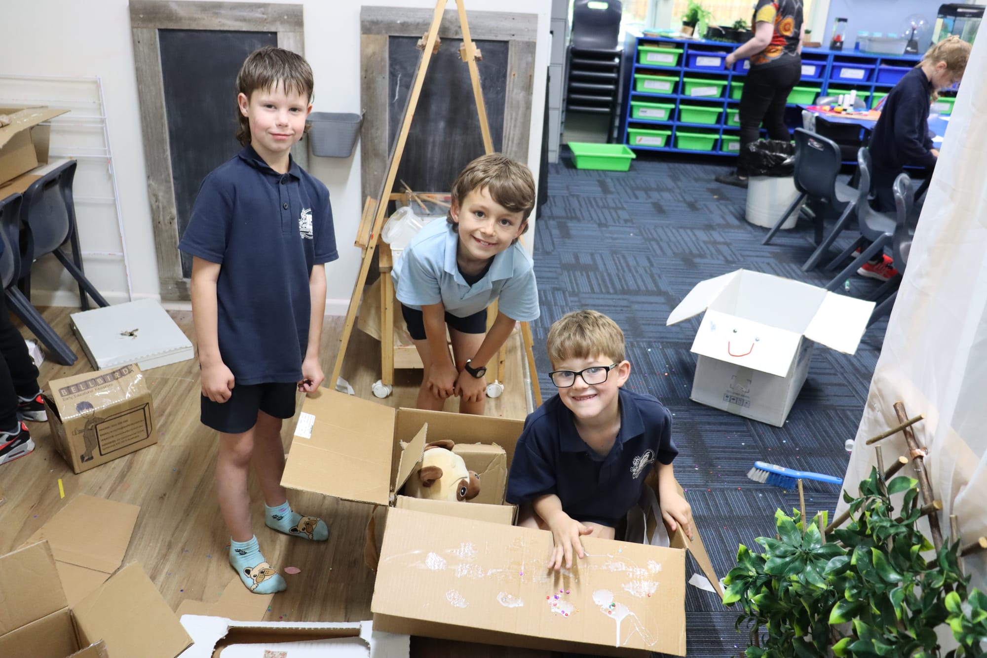 Showing off their cardboard car racers are  (l to r) Turbo, Saxon and Zac
