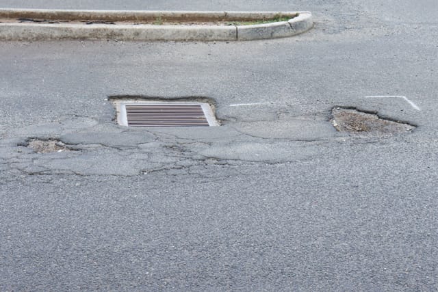 Pot Holes Woolies Carpark - 10.02.2022