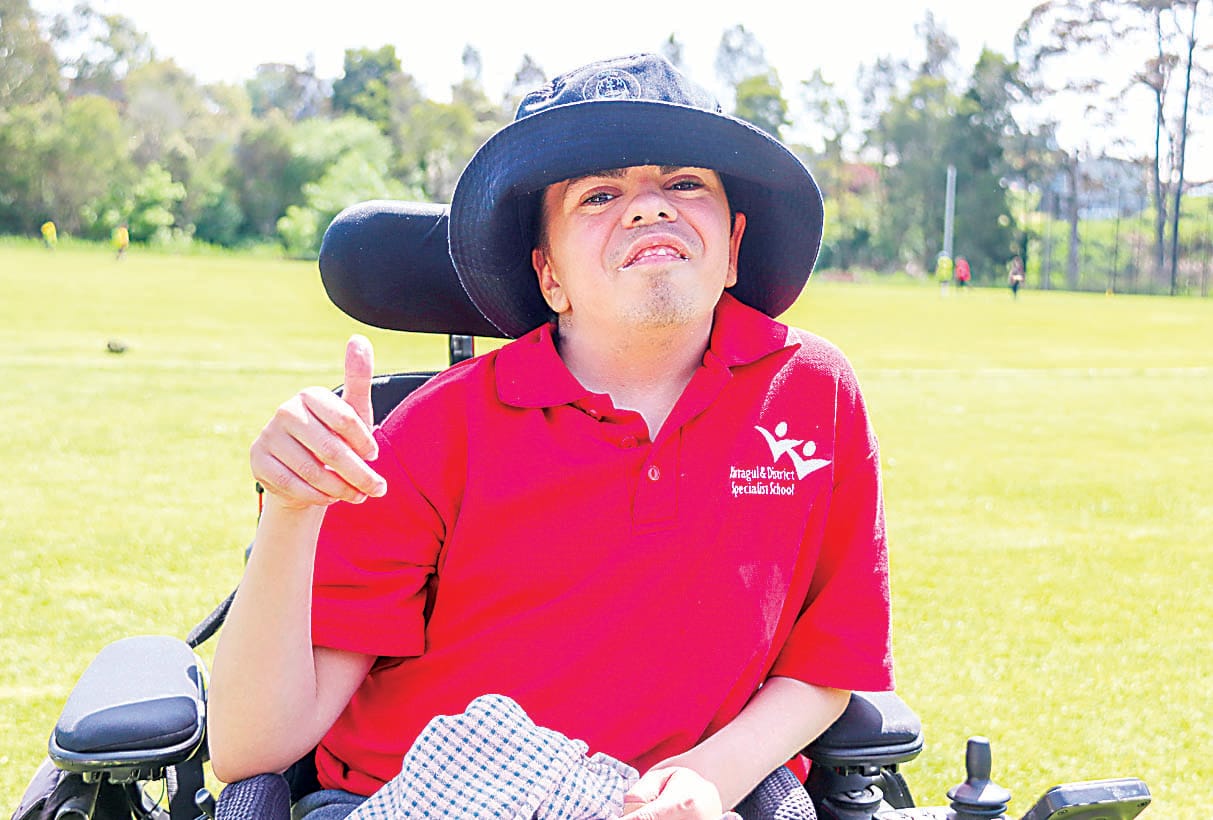 Noah cheers on the senior students during the 400 metre race.