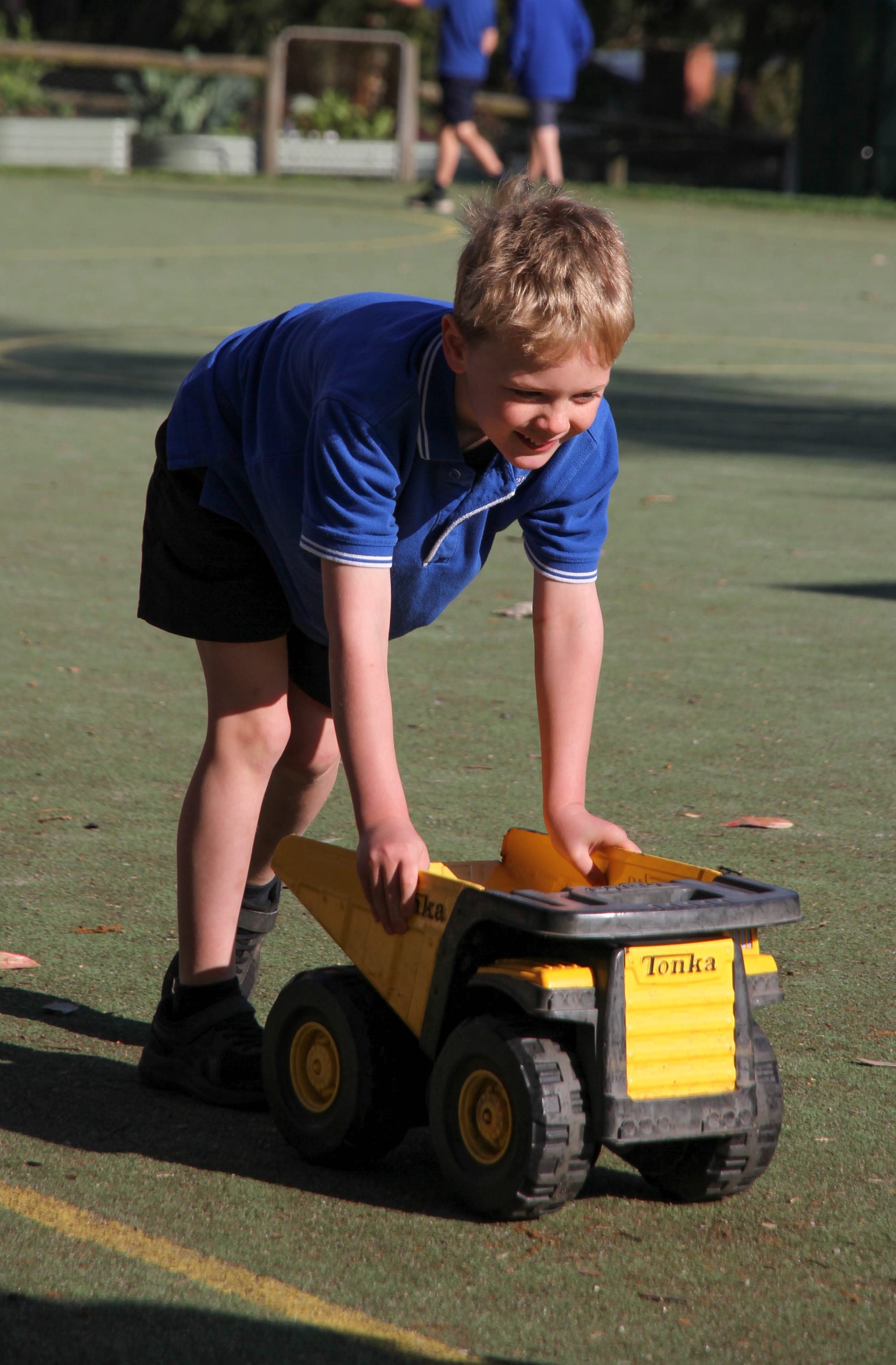 Lachlan Palavikas ensures his Tonka truck is part of the fun on Walk to School Week.