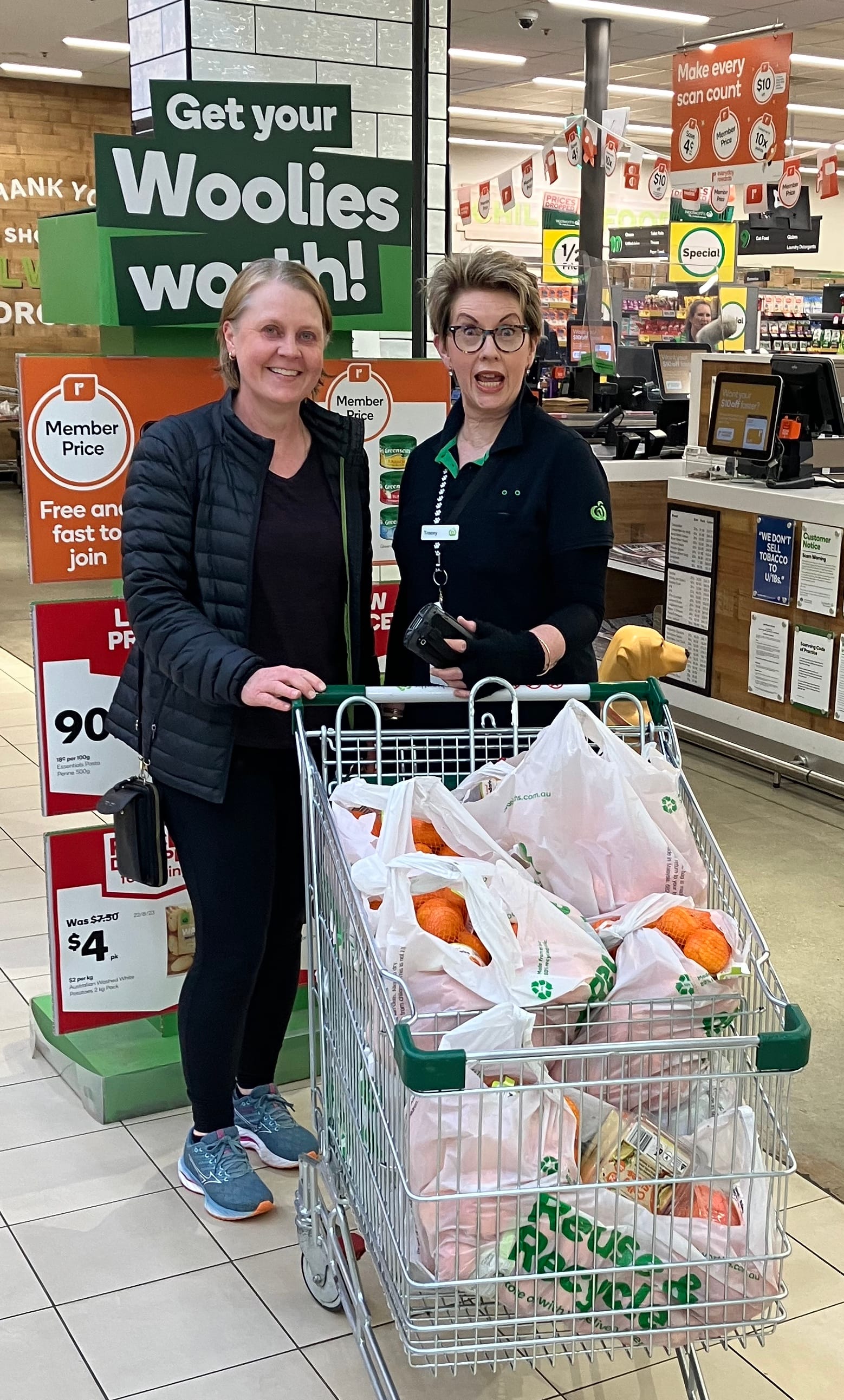 Drouin Primary School teacher Michelle West accepts a donation from Tracey at Woolworths.