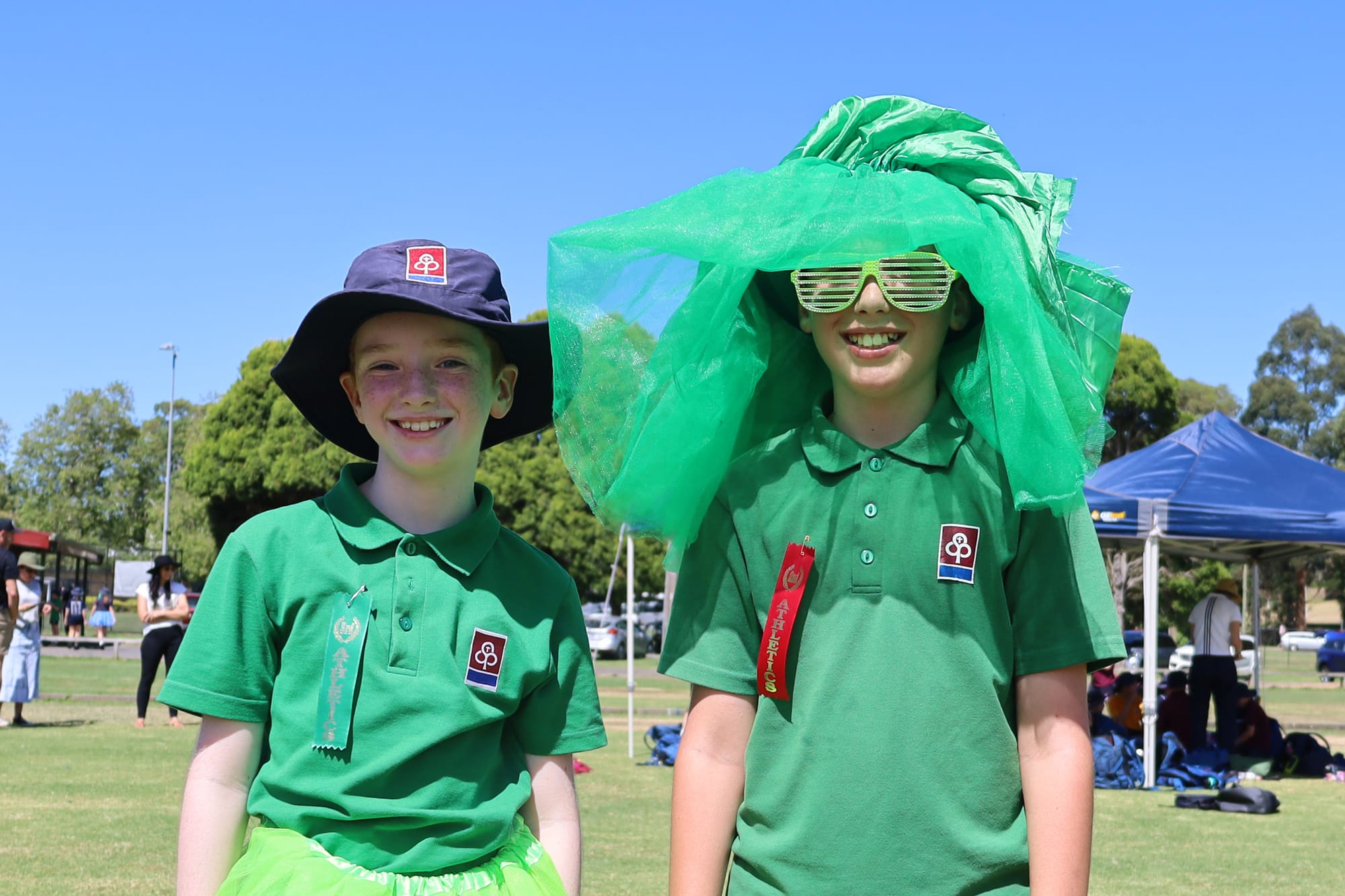 Year six students Lochie Chandler and Ash Bramstedt don their green outfits in support of Emerald House.