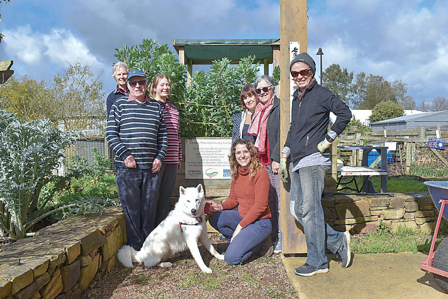 Nola Anderson, Ralph Slaughter, Georgia Mitchell, Frida the dog, Zoe Clarke, Gail Smith, Marg Stammers and Glenda Trevaskis at the community garden in late August.