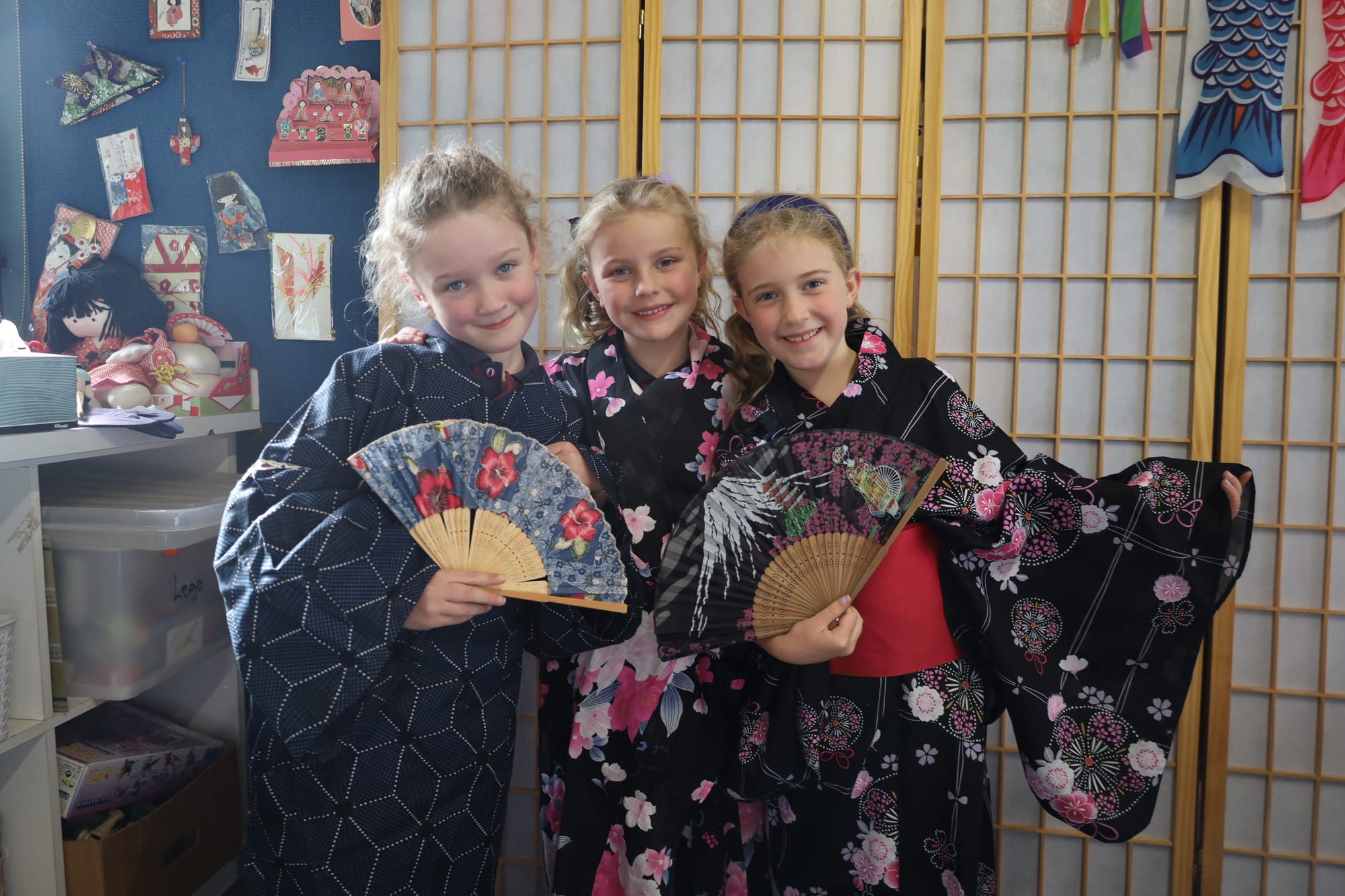 Fully immersed in Japanese culture are Olwen Cryle, Ruby Elliott and Claire French.