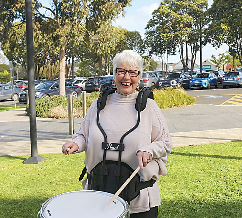 Left: A member of the Warragul Municipal Training Band, Glenys Marriott came along to the workshop to try her hand at marching drums.