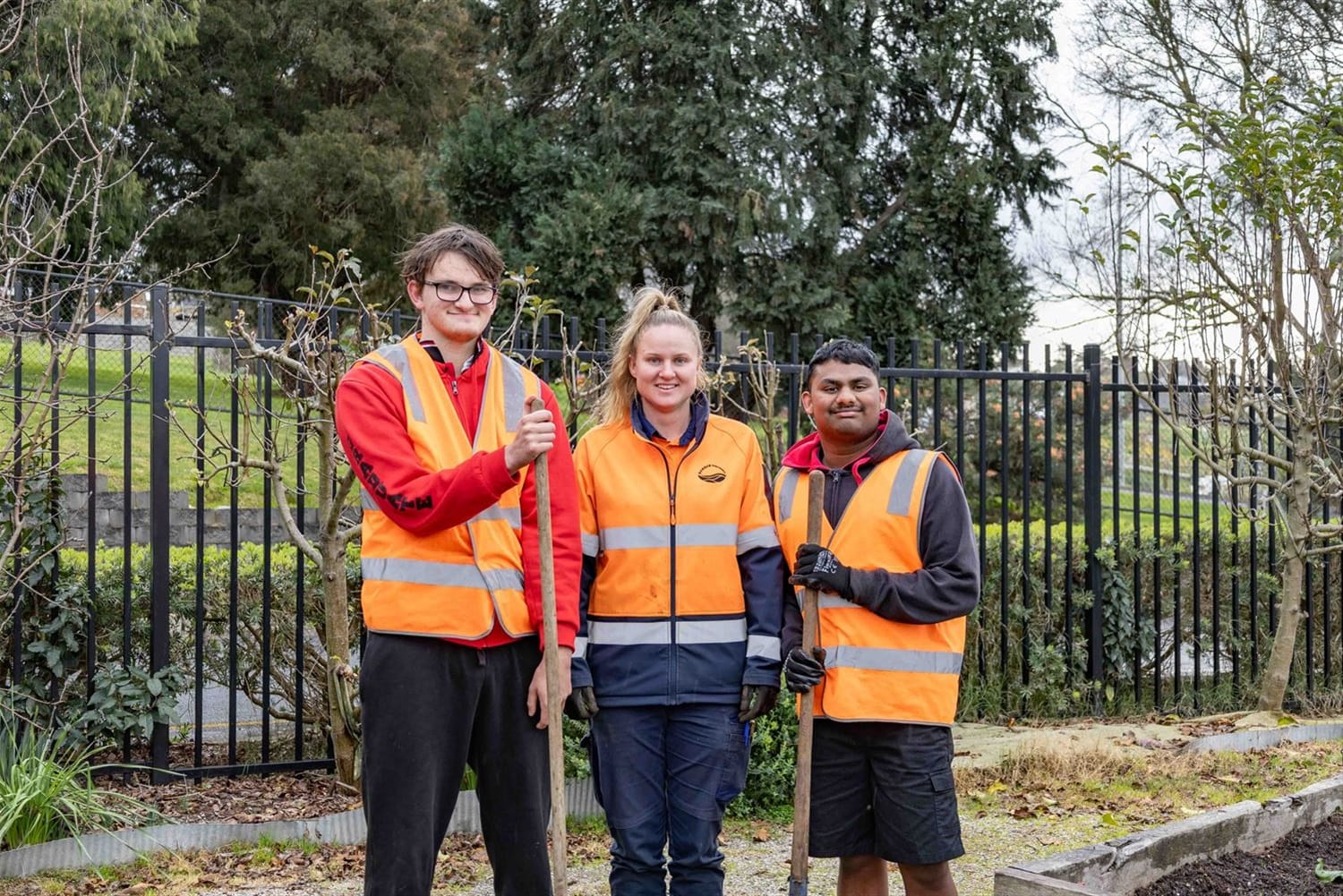 Ready with the tools and to start their work experience placement with Baw Baw shire's open space team were Warragul and District Specialist School students Liam (left) and Melvin with council staff member Kate.
