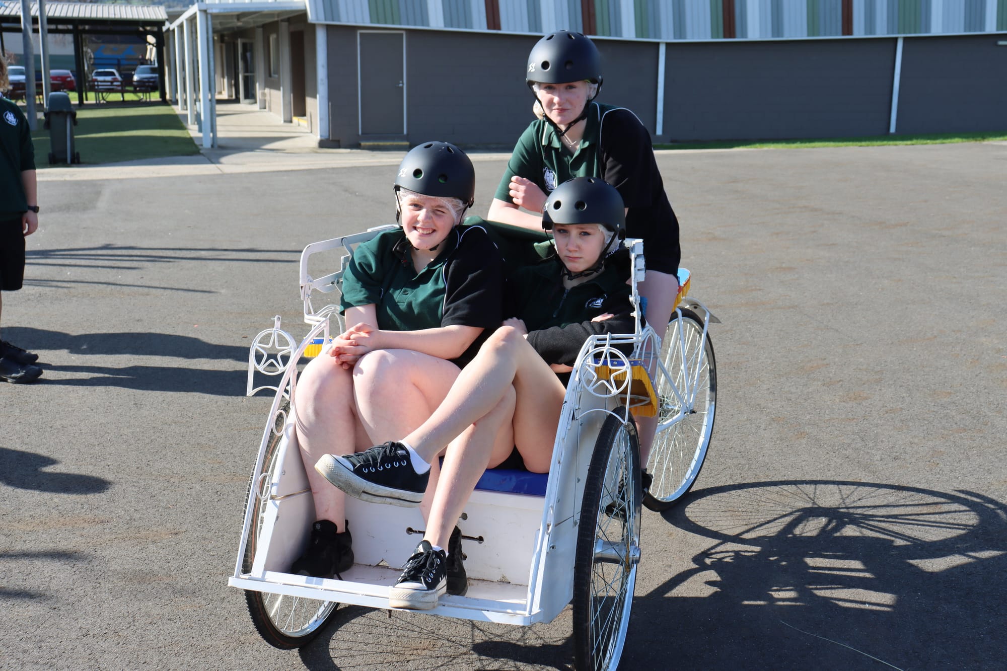 Sophie Gray and Summah Kalyk are driven around in their Batak by Kasey O'Reilly