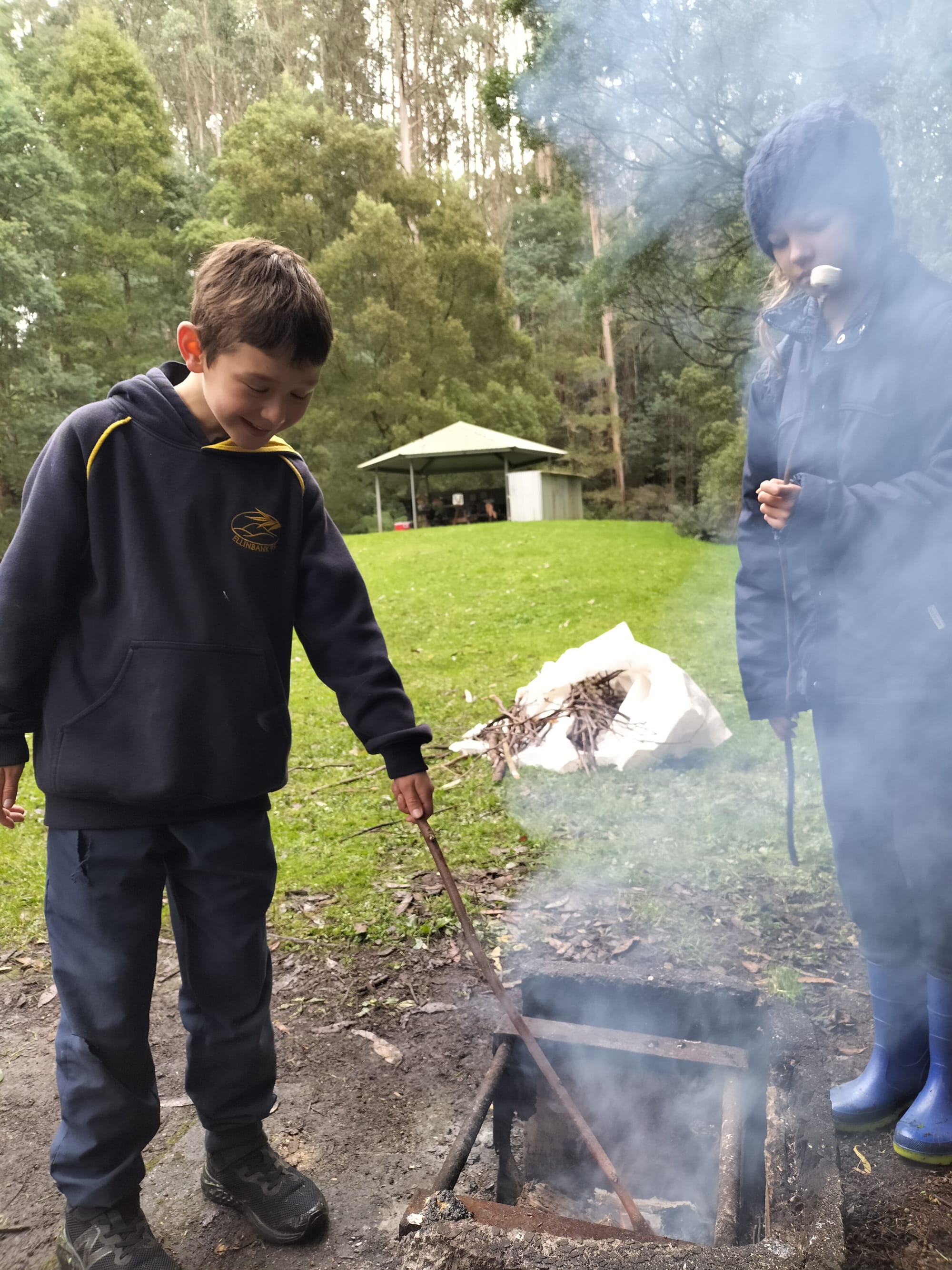 Max Mitchell and Eden Conroy tend to the fire.