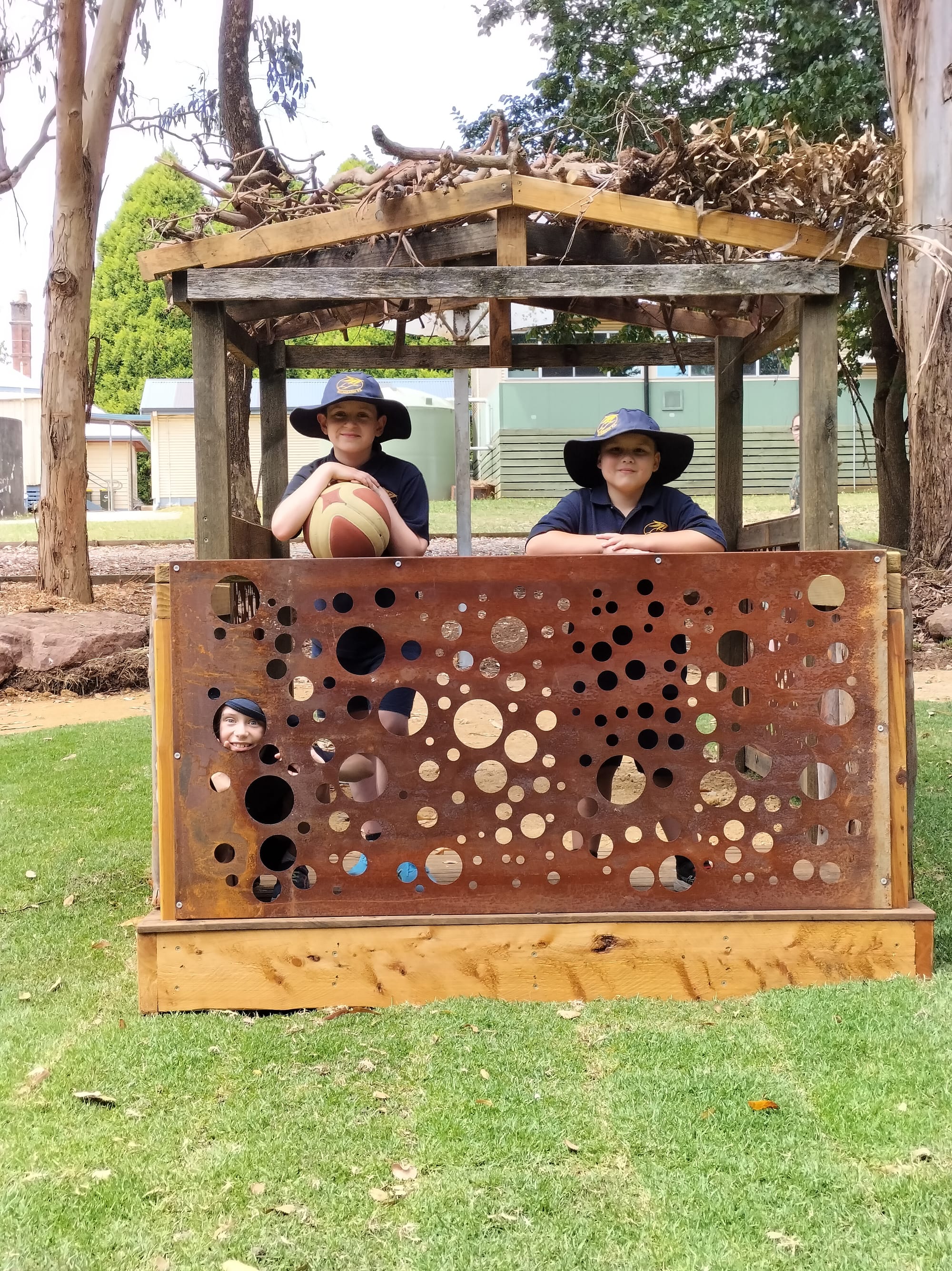 Angus Pollock, Xavier Donnelly and Yumi Taylor (lower left) enjoy the new sensory playground.
