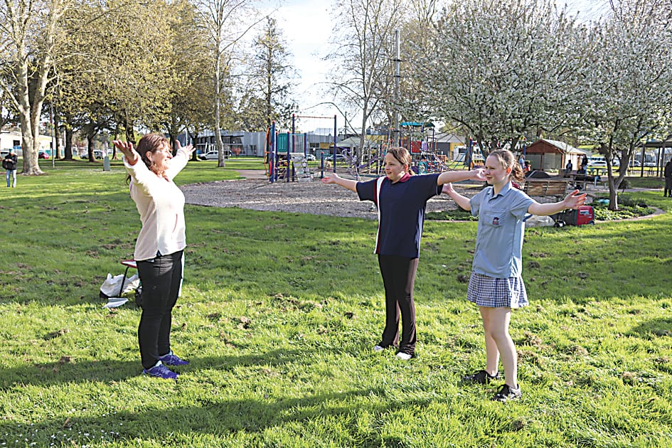 Above: Doing some Tai Chi at Burke Street park are YMCA's Robyn McCraw with students Rylee Peters and Layla Hartland.