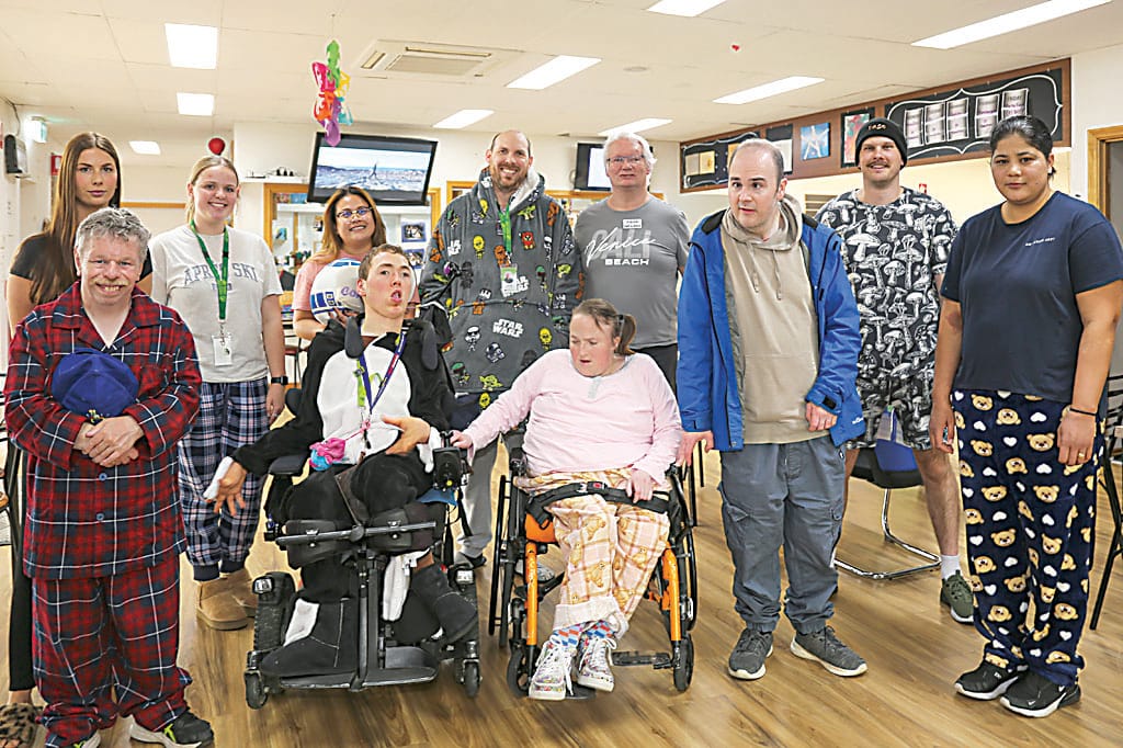 Clients and staff at Cassidy Crew in Warragul took part in Gippsland's Biggest PJ Day recently, wearing their pyjamas to support children in out of home care (back) Jessica Nalty, Maddi Bransgrove, Kristie Avendio, David Scott, Daniel and Christoper Redl (front) Dale, Malachy, Cassidy, Daniel and Mandeep Kaur.