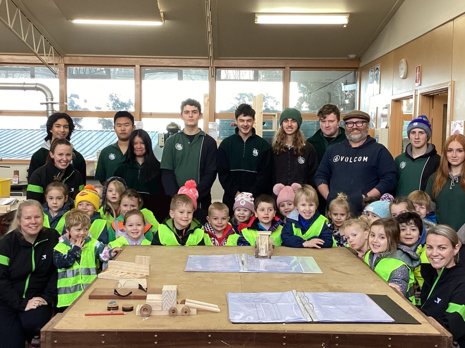 Napoleon Romagnino, Zach Thompson and Alexis Rossi (obscured) work on the kindergarten project.