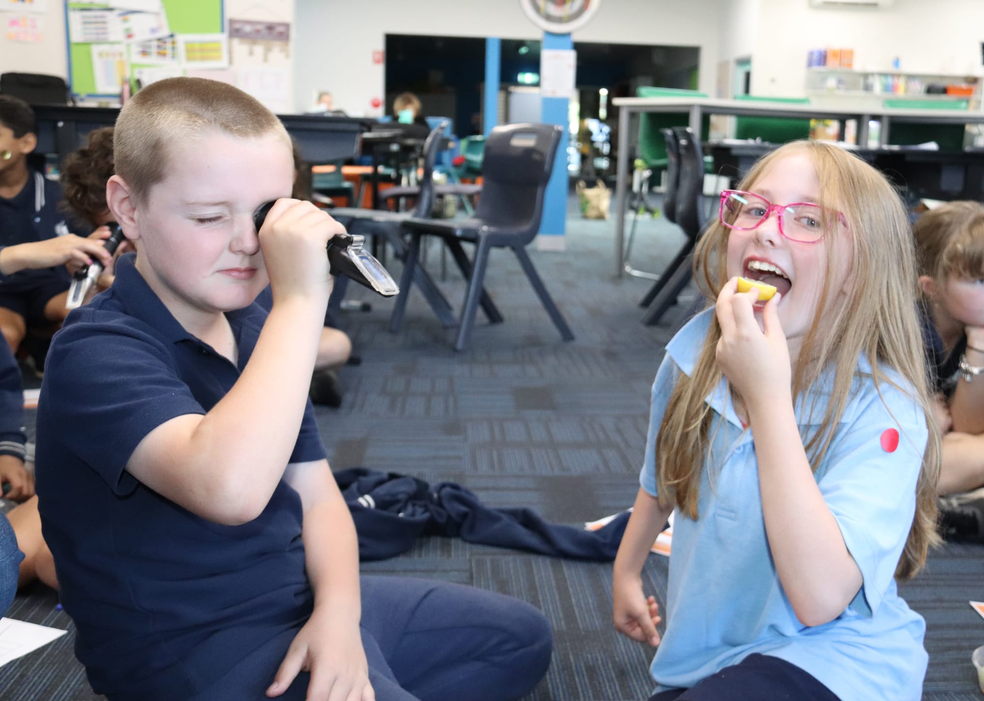 Quin uses a device to study some fruit while Savanna decides to study it a different way.