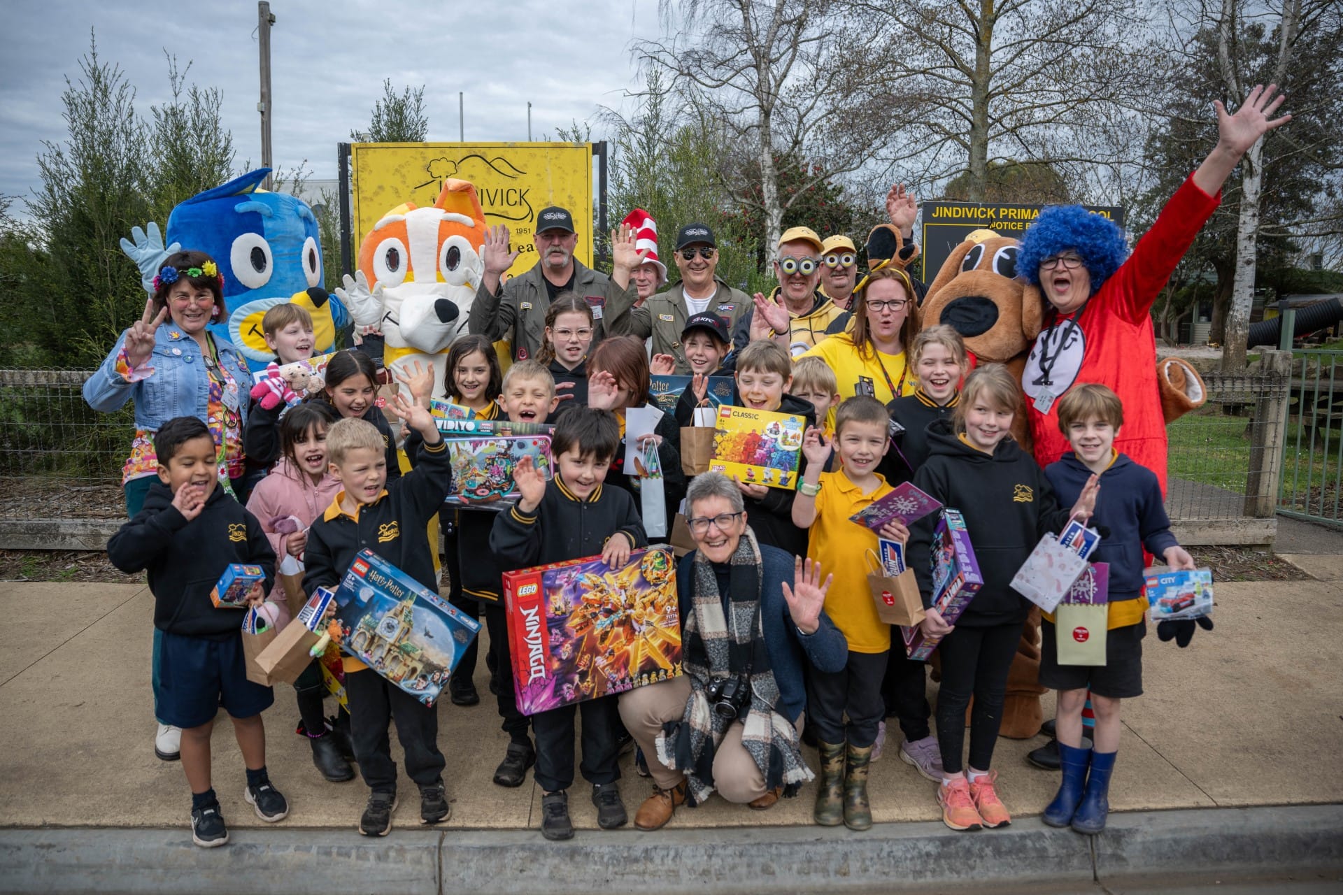Variety club bash participants and students from Jindivick Primary School show off the Lego sets donated by the club