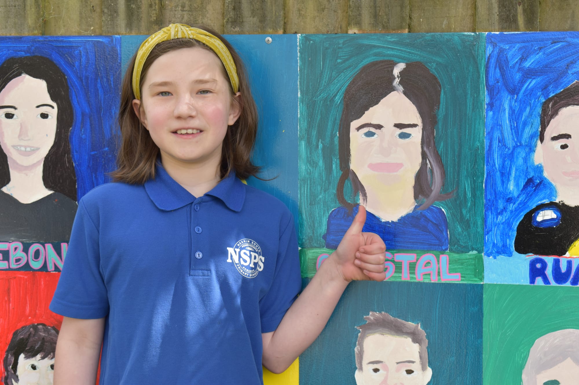 Crystal Airge is proud of her contribution to the mural.