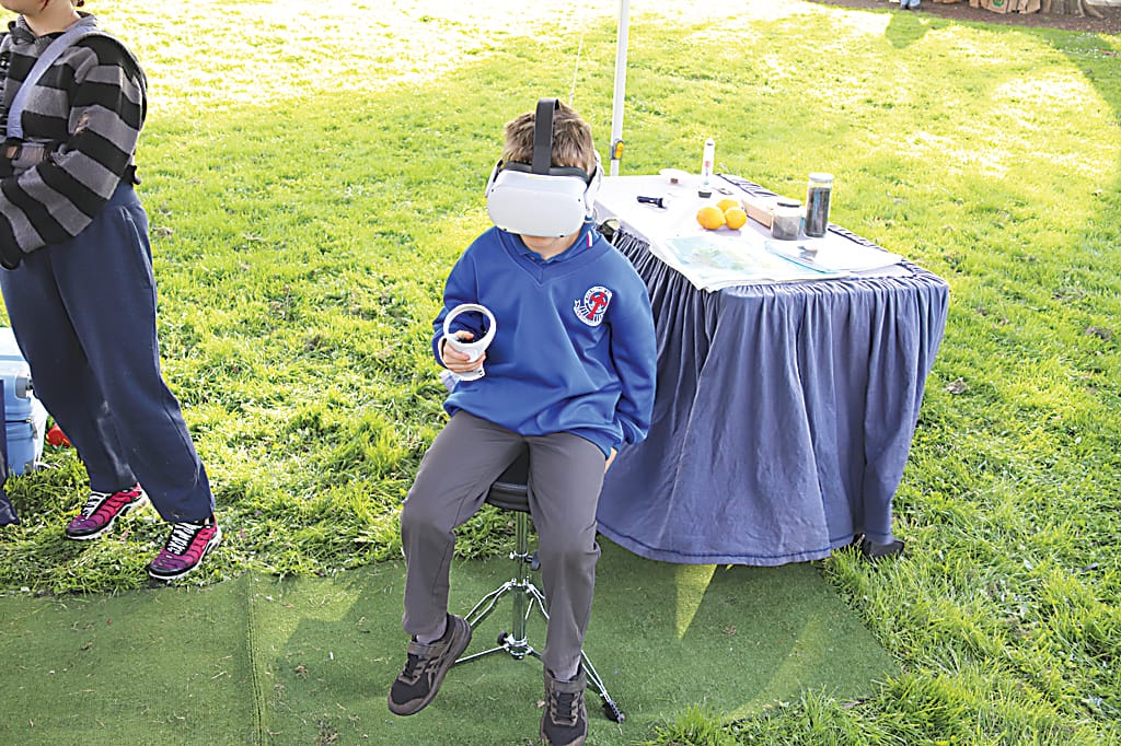 Right: St Ita's student Jack Perry tries out the GCCN 