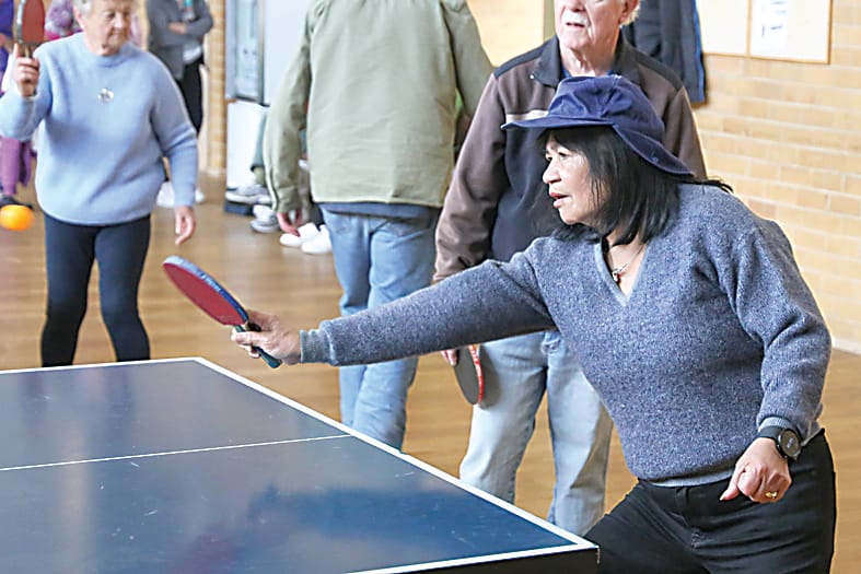 Going aggressive with her forehand is Peachy Kenny.