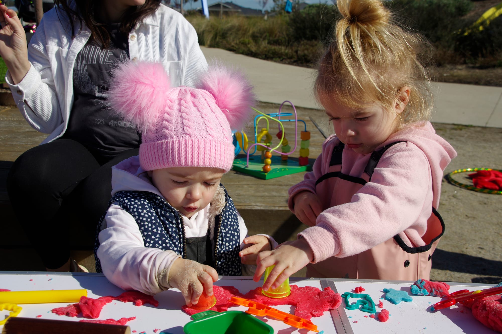 Demi and Navy Marsh of Longwarry play with Play Dough at the pop-up playgroup session in Drouin.