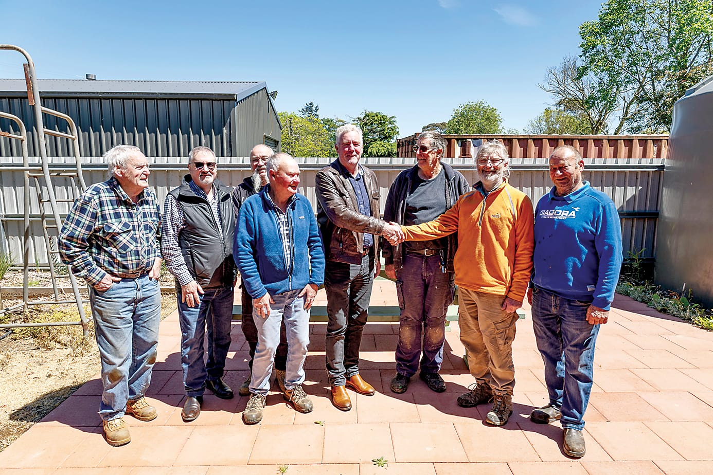 Celebrating a $10,000 grant for Neerim District Community House and Men's Shed alongside Baw Baw Shire councillor Adam Sheehan are (from left) Graham Edyvane, John Batt, Albie Wild, Jim Rae, James Babb, group president Phil Treacy and Rob Matthews. The grant will be used to help build a barbecue and entertainment area.