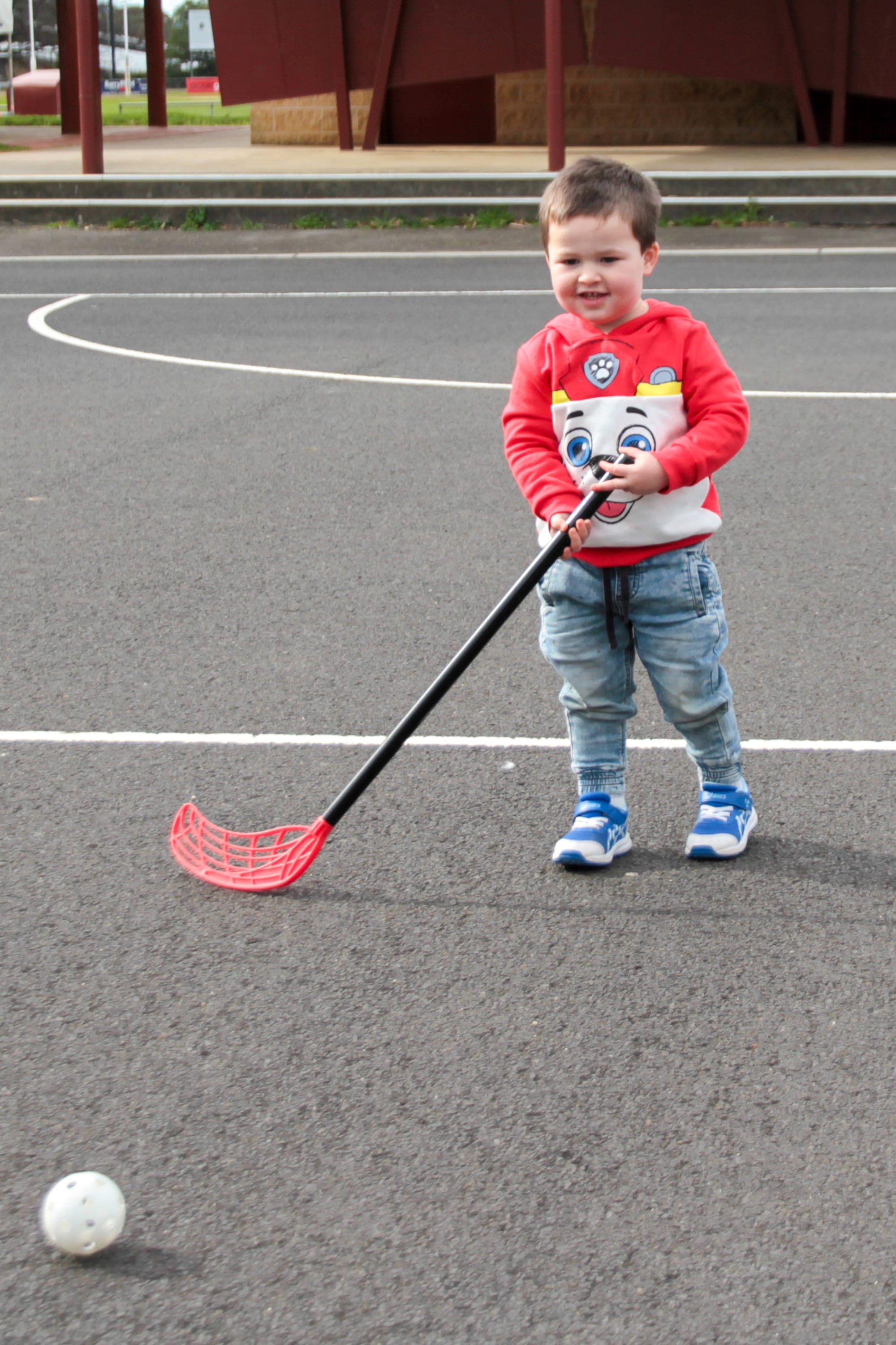 Harley Richards waits for the ball to come his way in hockey.