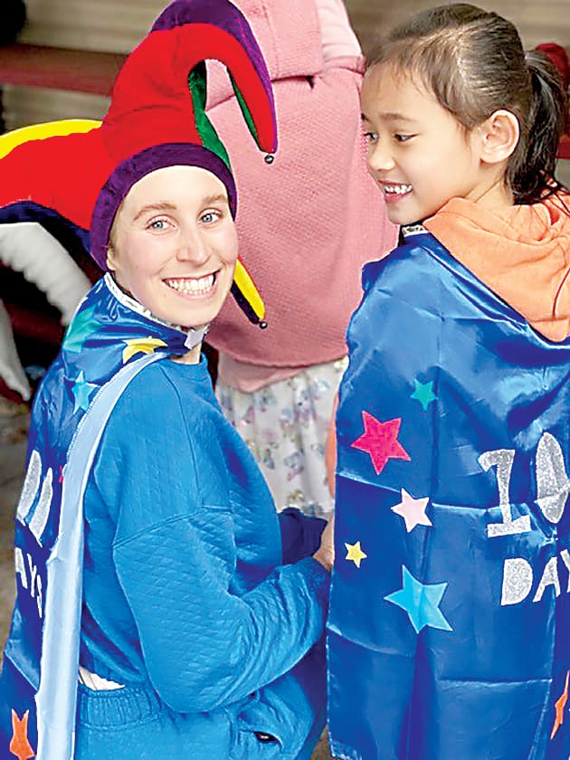 Teacher Millie Slate and Bonita James show off their bright costumes.