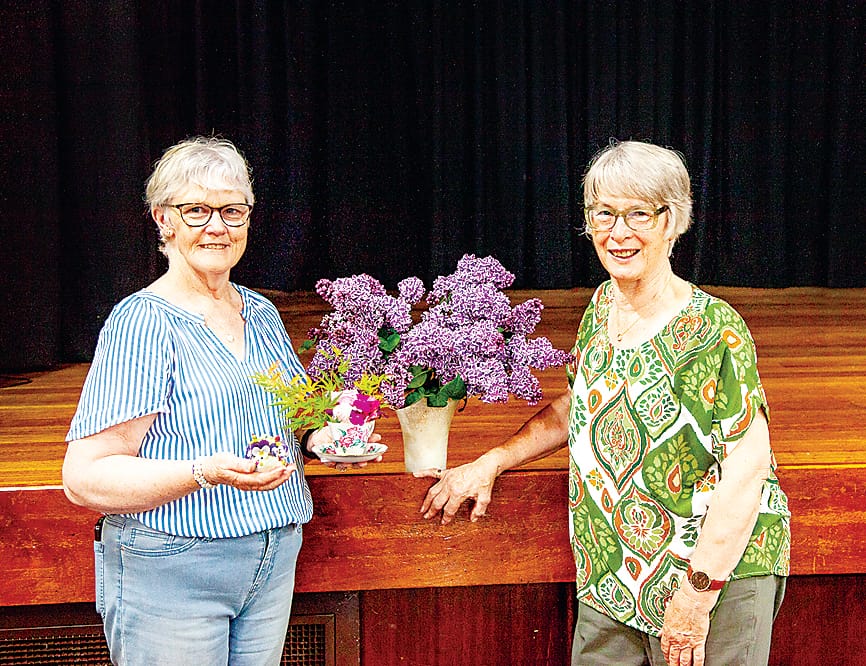 Christina Robinson and Maureen Benson with their winning exhibits at the flower and photo show.