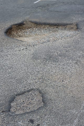 Pot Holes Woolies Carpark - 10.02.2022