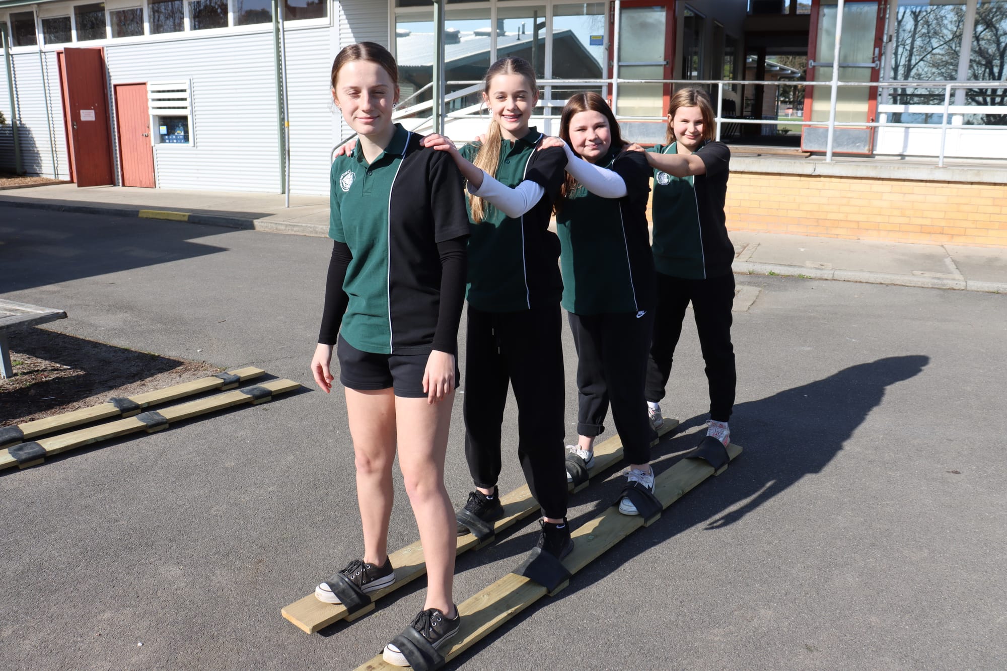 Lilly Gooding, Maya Robinson, Payton Carrick and Skye Moles participating in a traditional Indonesian 