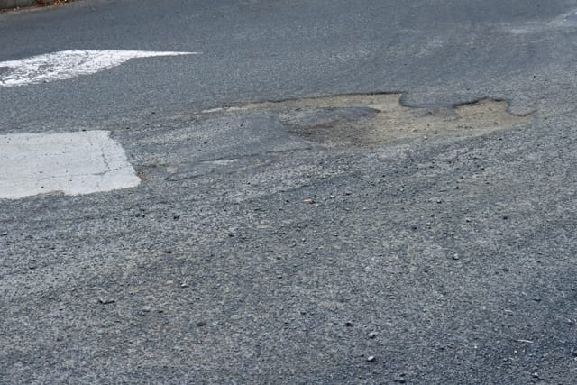 Pot Holes Woolies Carpark - 10.02.2022