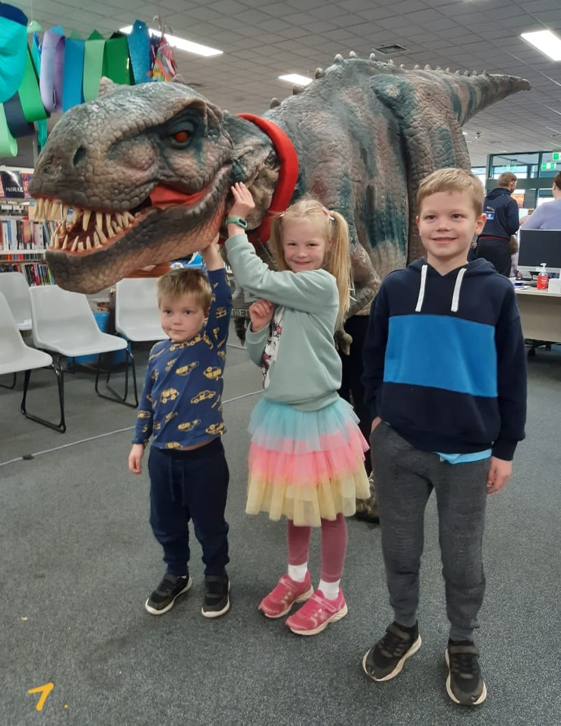 Meeting Toby T-Rex at Warragul Library last week are Jack (age four), Isla (age six) and Archer (age seven) Mumford.