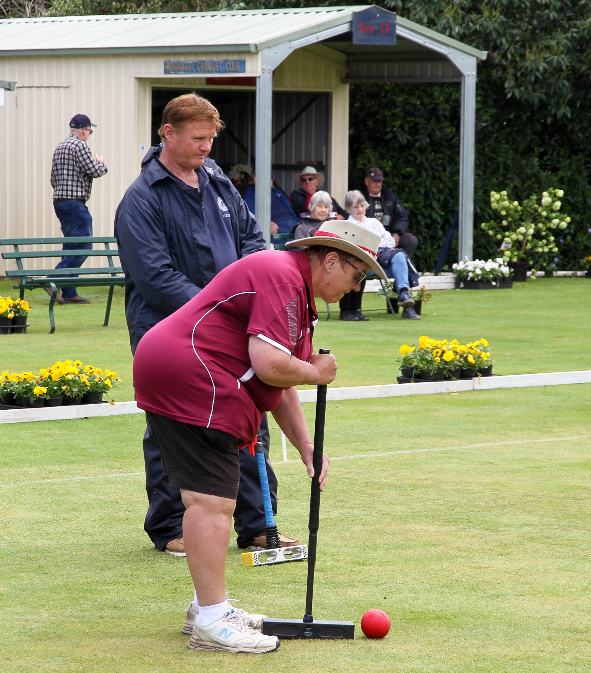 Steve Hodolak watches on as opposition Virginia Wheeler from Wonthaggi takes a shot