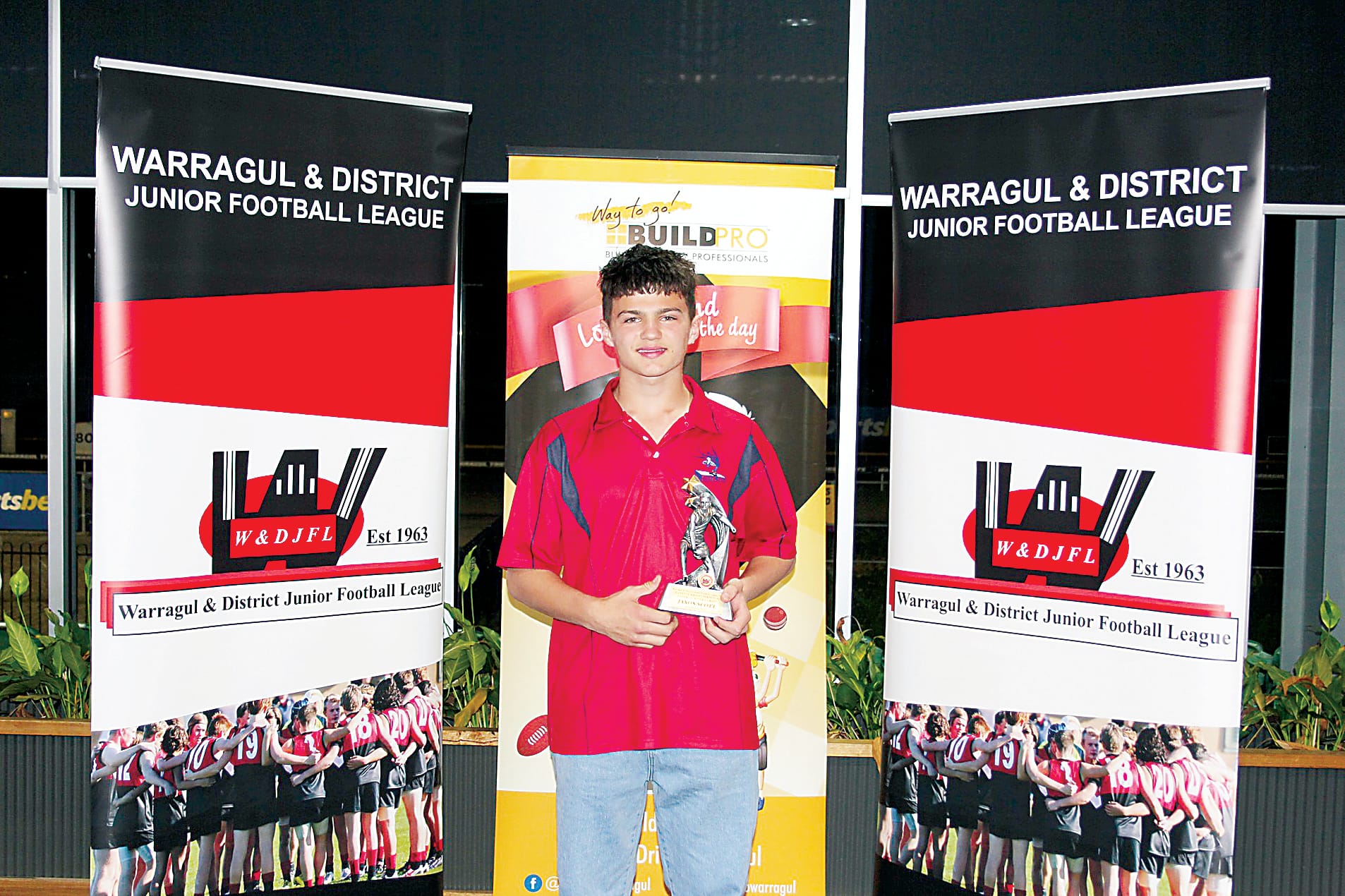 Buln Buln's Jaxon Scott accepts the under 14s best and fairest award.