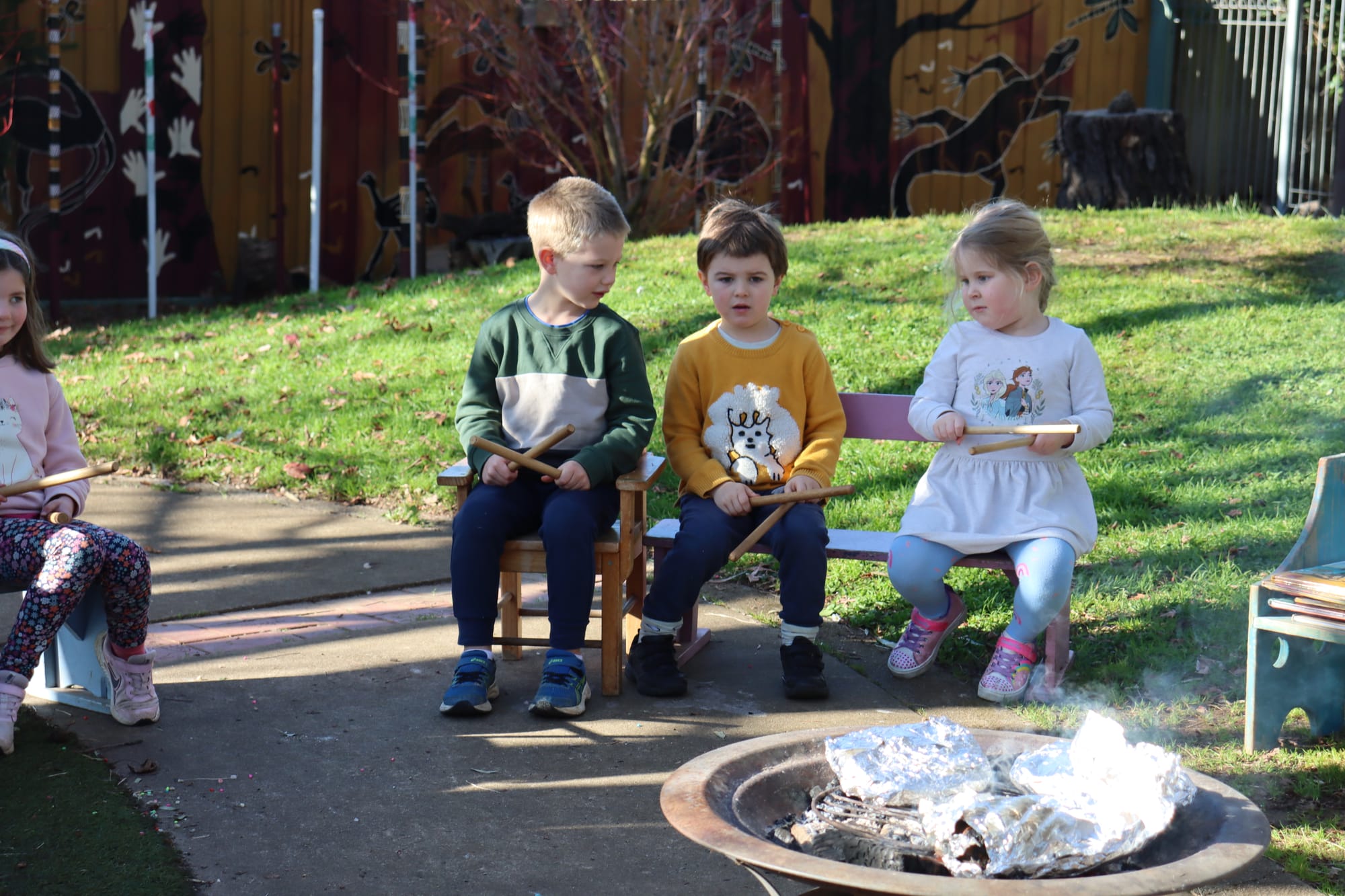 Henry Beasley, Robin Cuthbertson and Evie Davis enjoy the campfire.