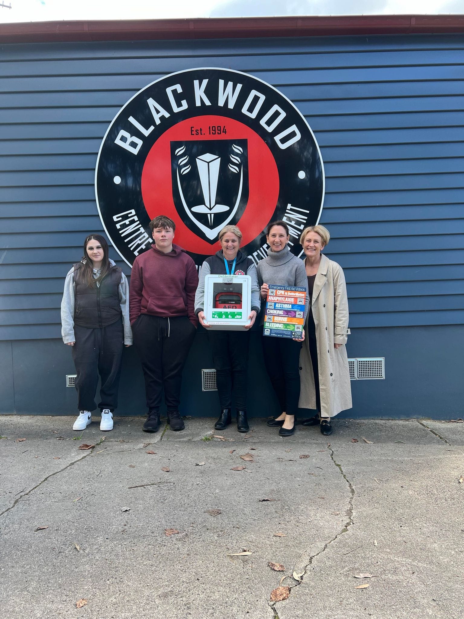 Labertouche Primary School now has a defibrillator. Pictured at the presentation are A Girls' Day Out committee member Margie Whitford, Rorie, Matilda, Lachlan and principal Christie Bransgrove.