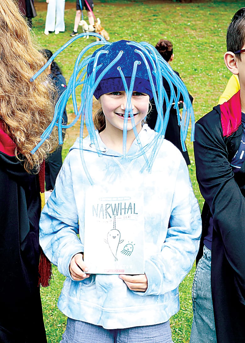Left: Year three student Amy Child displays one of her favourite books, 