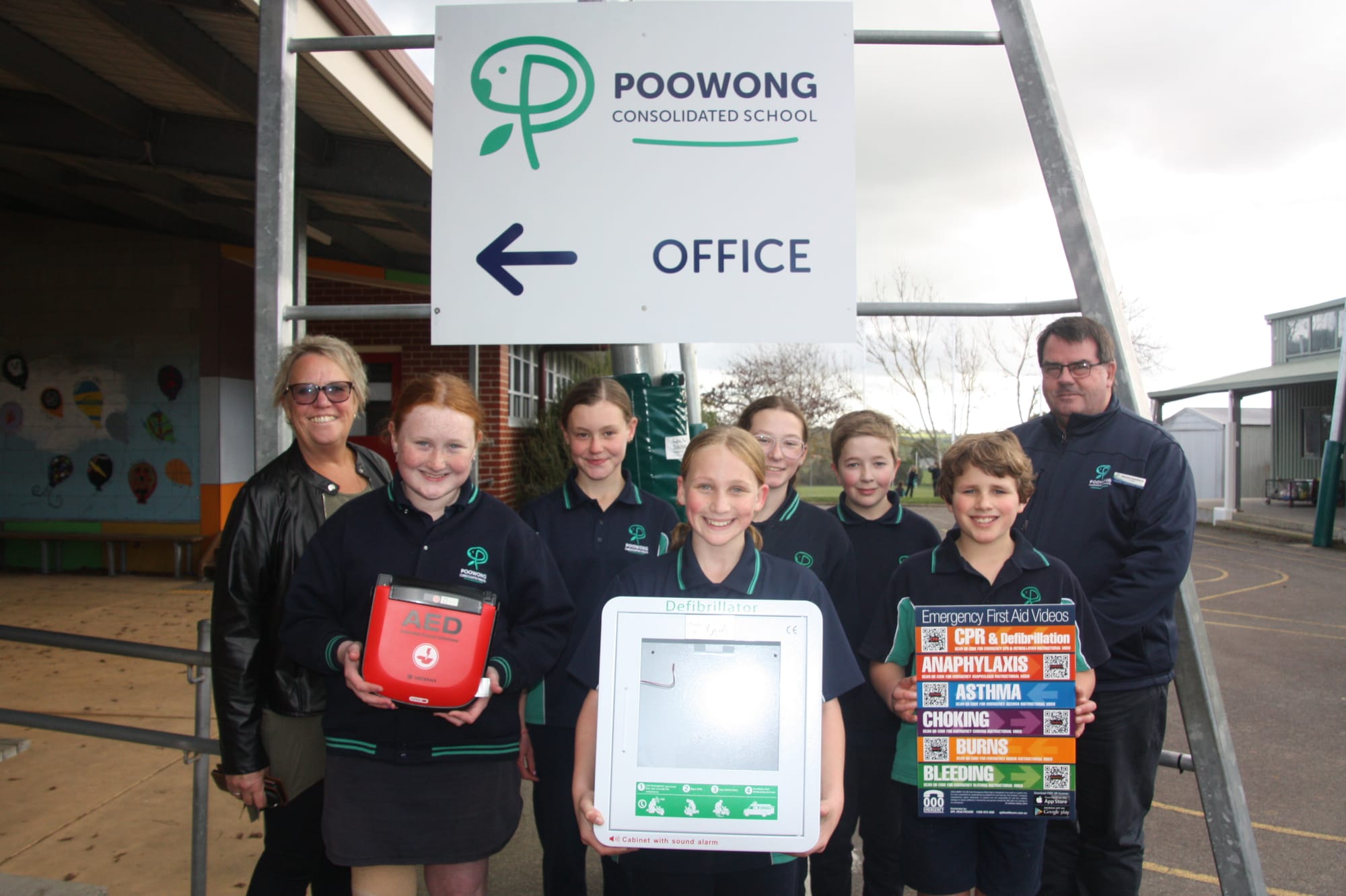 Margie Whitford, Charlytte, Madison, Olivia, Rudy, Tyson, Alfie and principal Michael  Smethurst at Poowong Consolidated School.