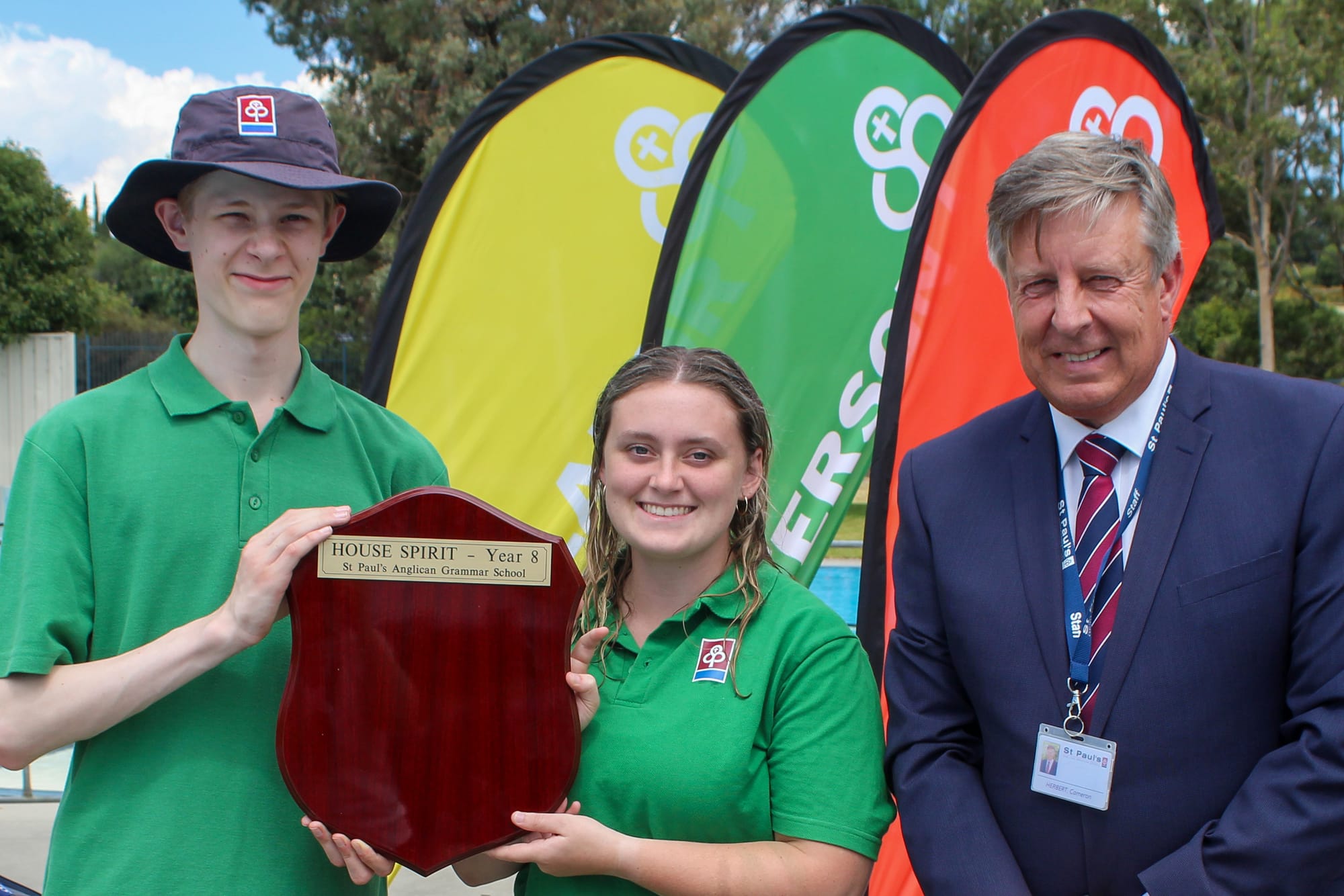 Paterson House captains Josh Cullen and Georgia Chapman with St Paul's principal Cameron Herbert.