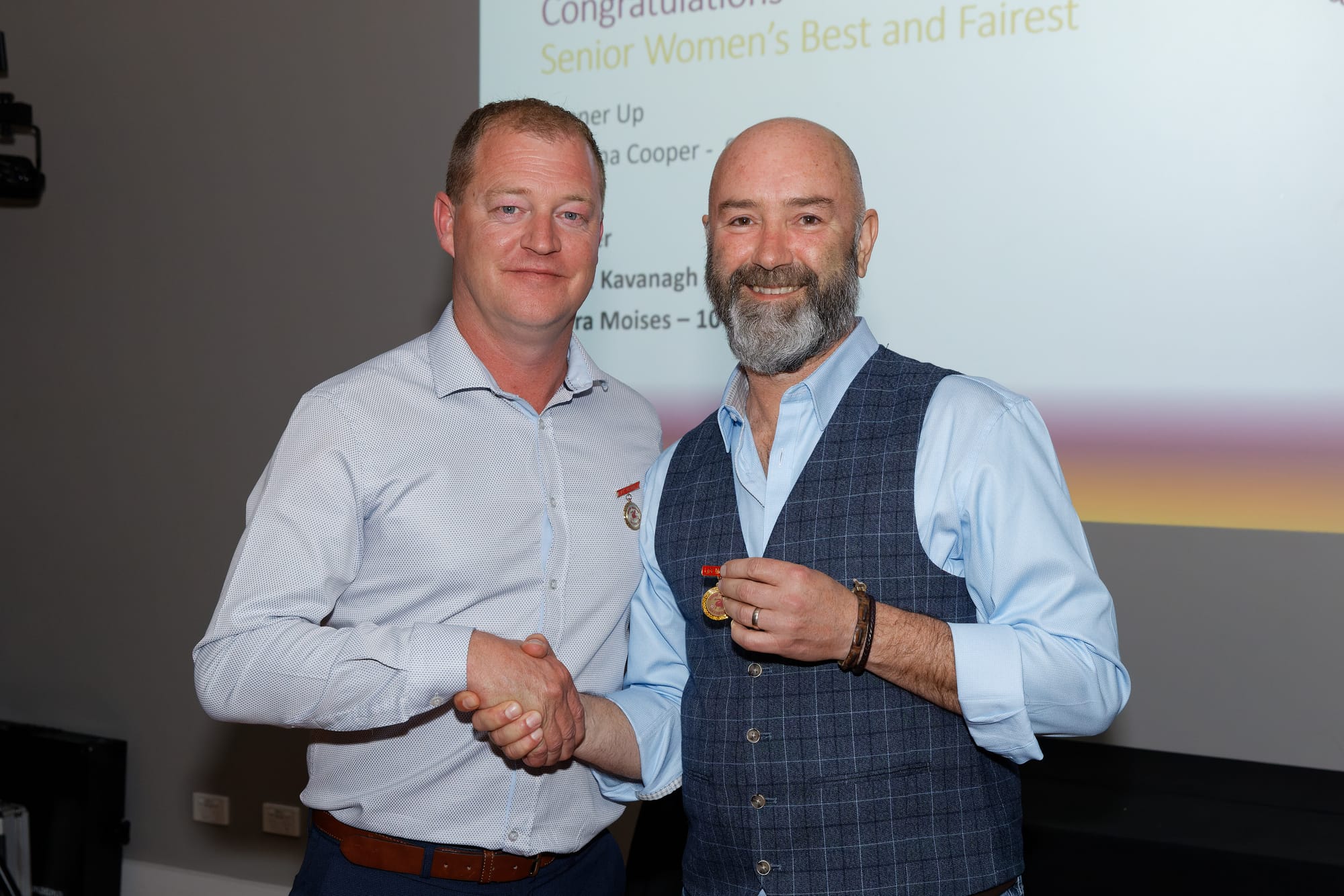 Previous club president Dan Brown presenting life membership to current president Jason Beer.