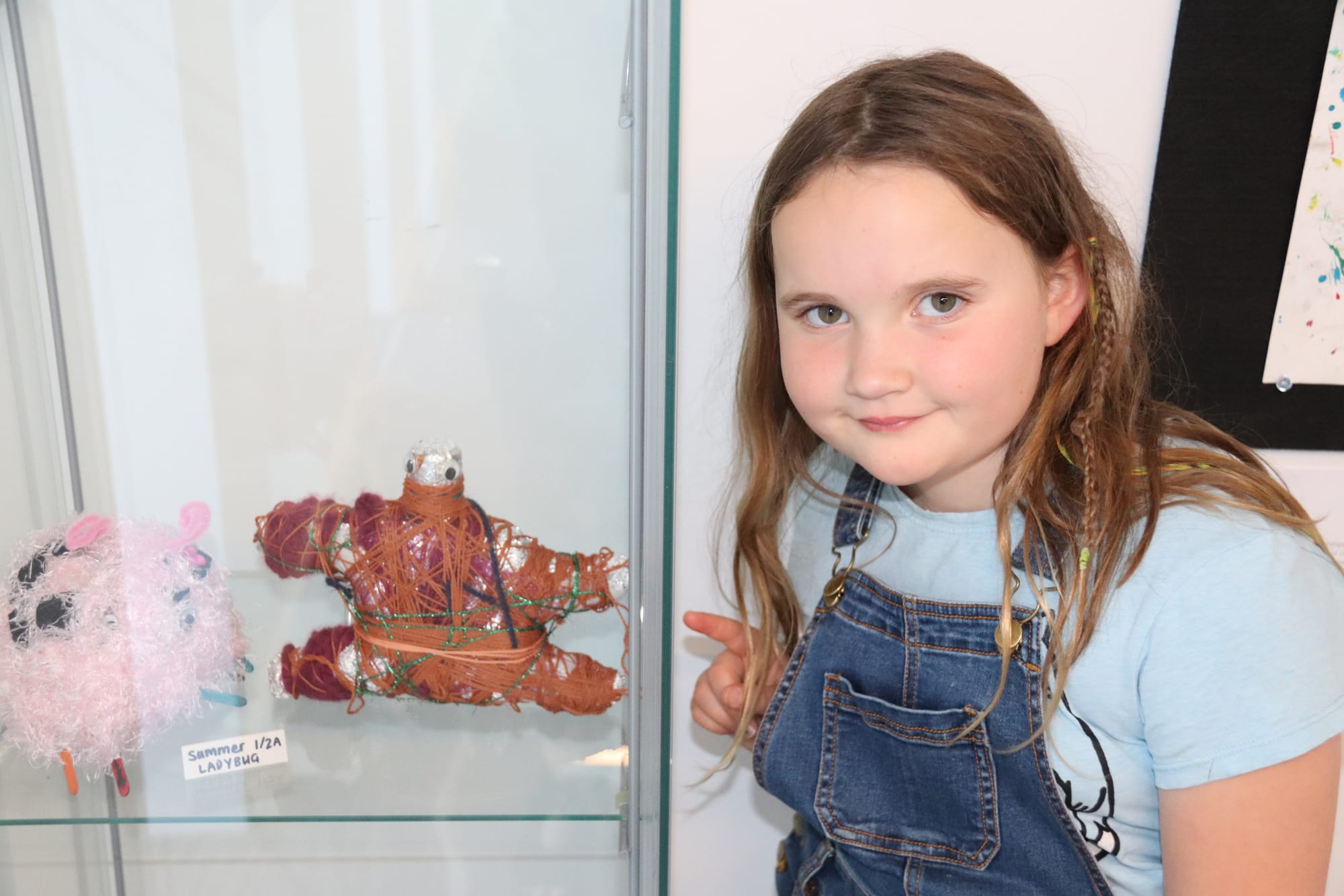 Showing off her creative sculpture is Mieke Earwicker.