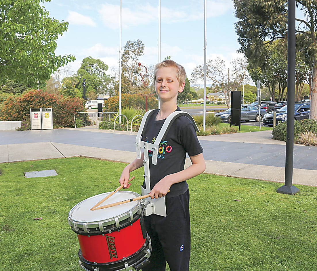Oscar Bijl stands proudly with his marching drum.