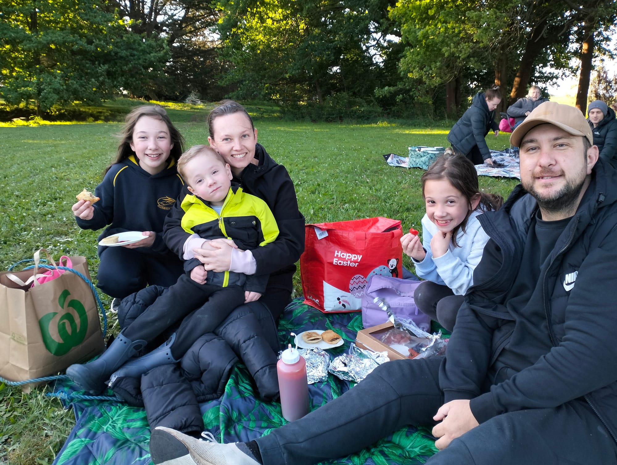 Esmaee, Arlo, Christie, Willow and Christian Gonzalez enjoy a picnic tea at the bonfire night.