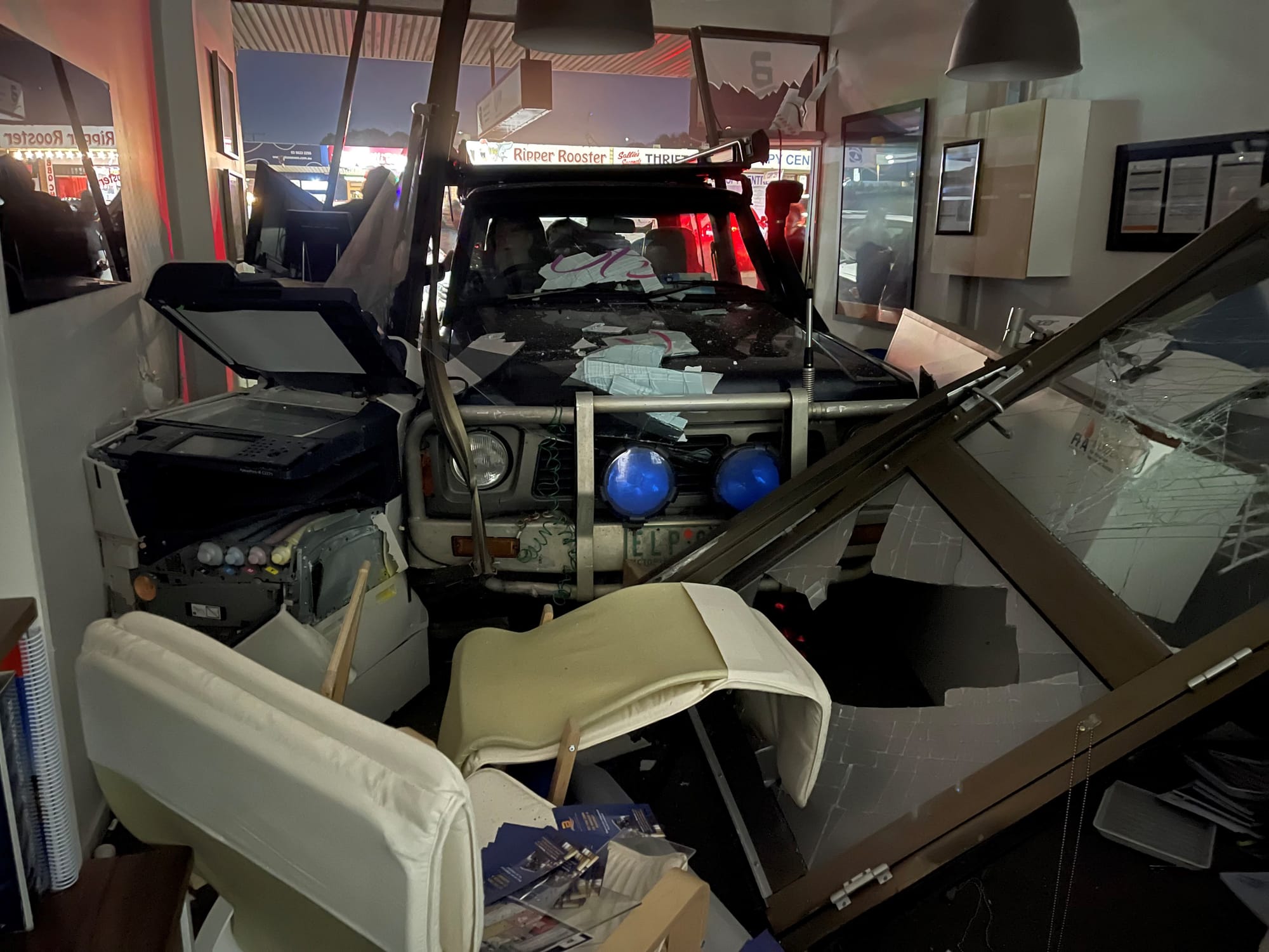 Car accelerates into office