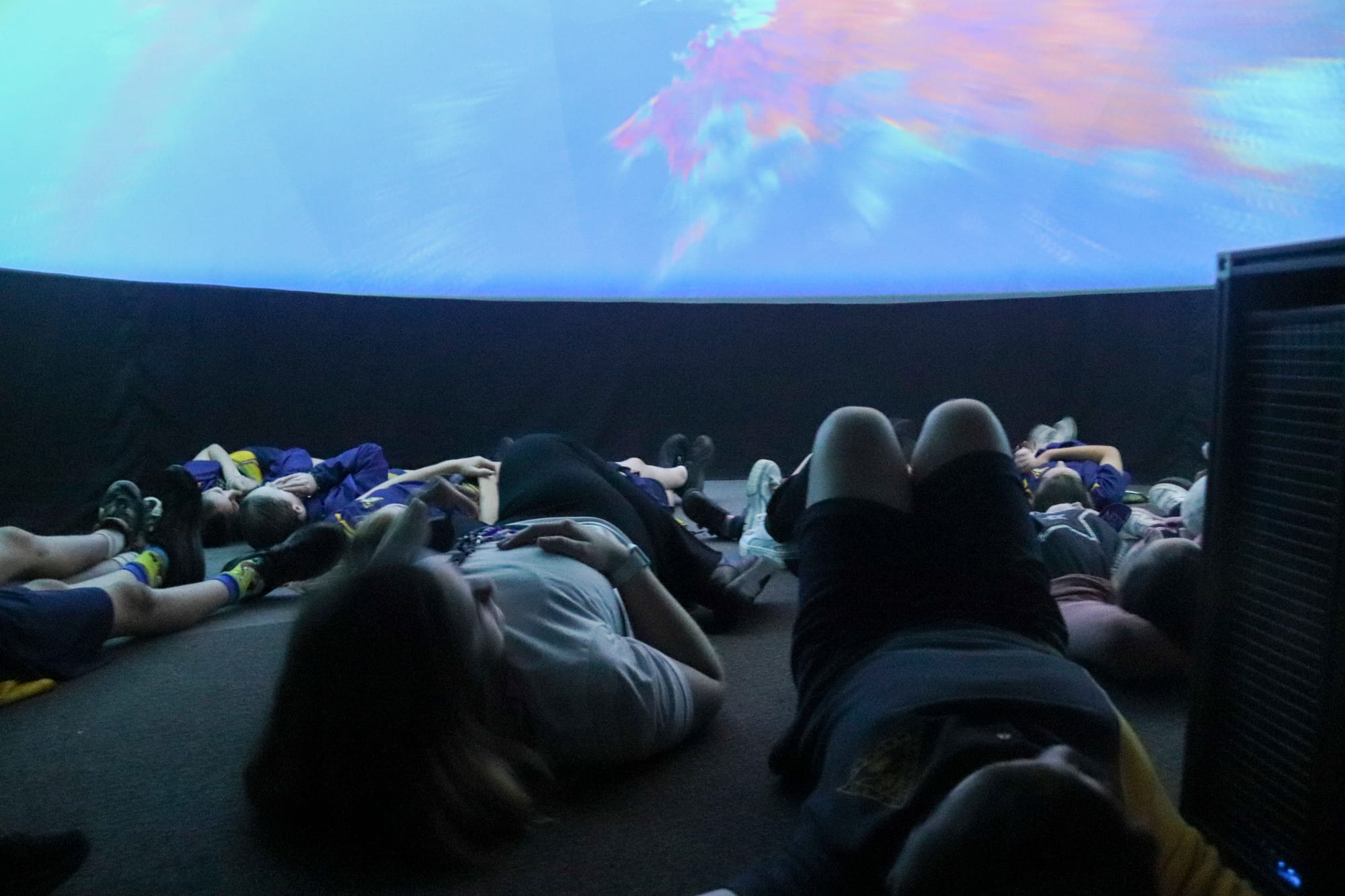 Students from Warragul North Primary School immerse themselves in the planetarium experience.