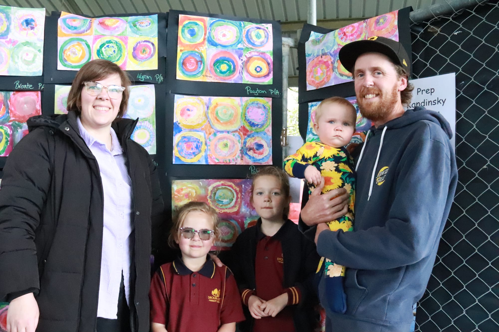 Showing their pa Daryl Steet the wall of Picasso inspired art at Drouin West Primary School's art show are Kayden (left) and Lynken Steet.