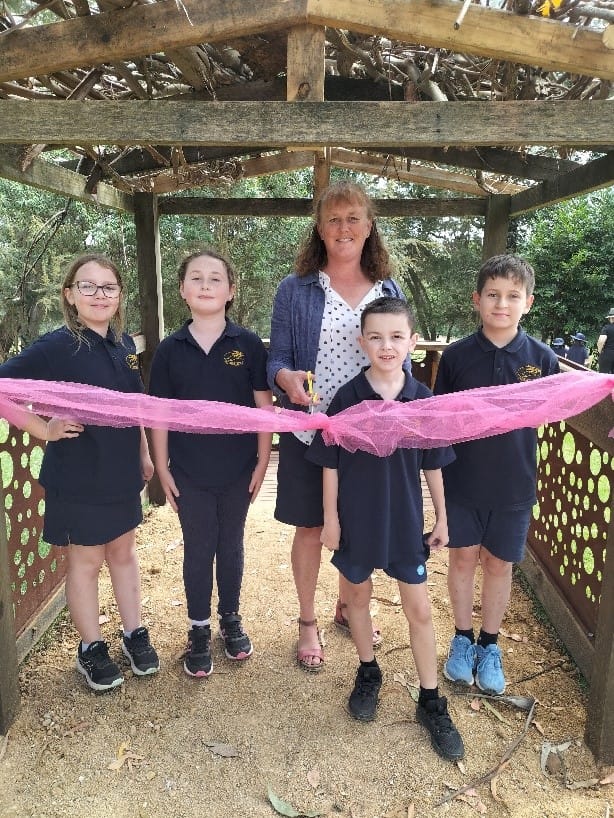 Camille Hanley, Eve Millar-Coulson, principal Catherine Clerks, Zayne Oldham and Angus Pollock cut the ribbon to open Ellinbank Primary School's new sensory adventure playground.