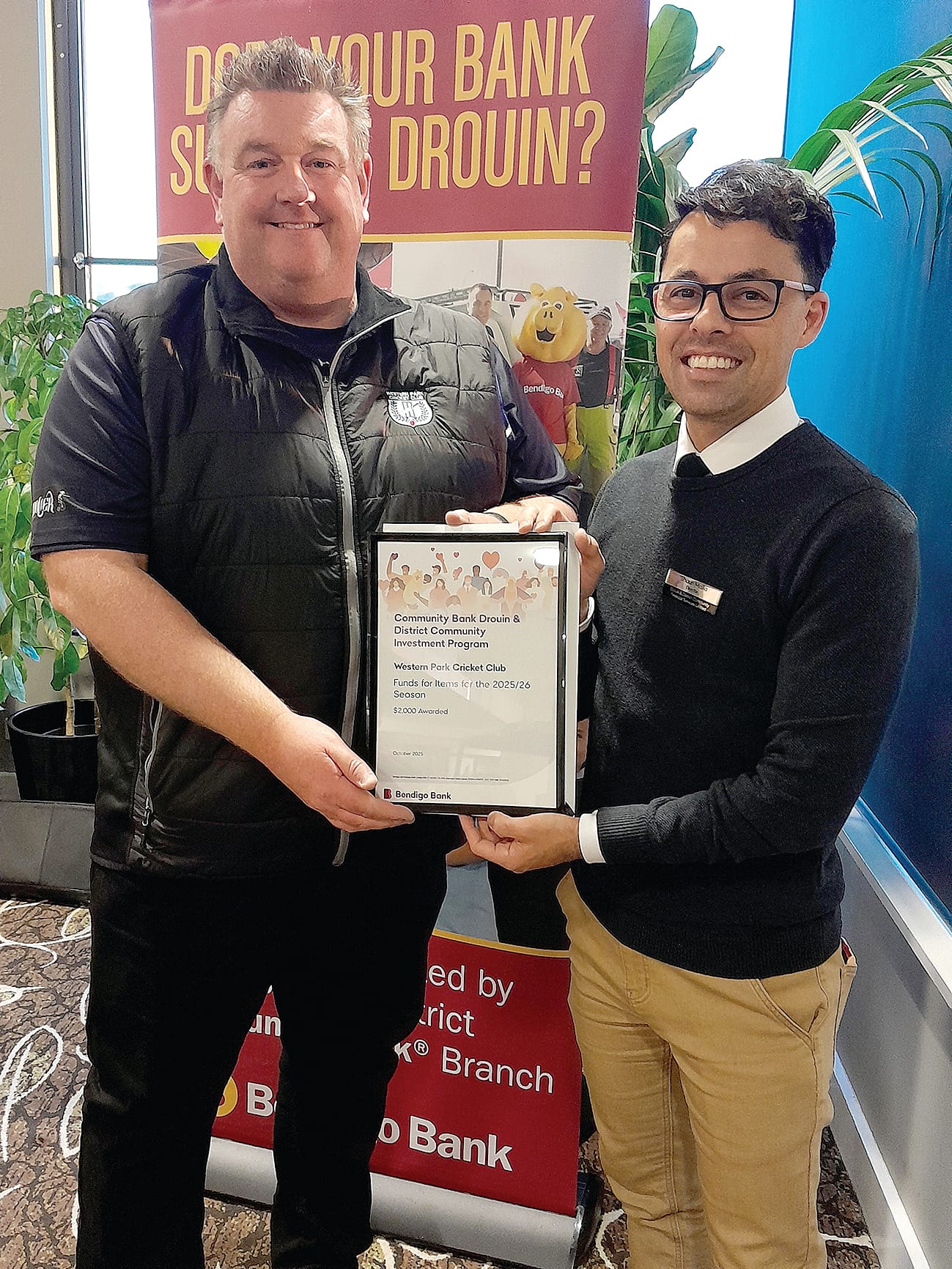 Western Park Cricket Club representative Marc Flemming is happy to receive sponsorship from bank director Shaun Mallia.