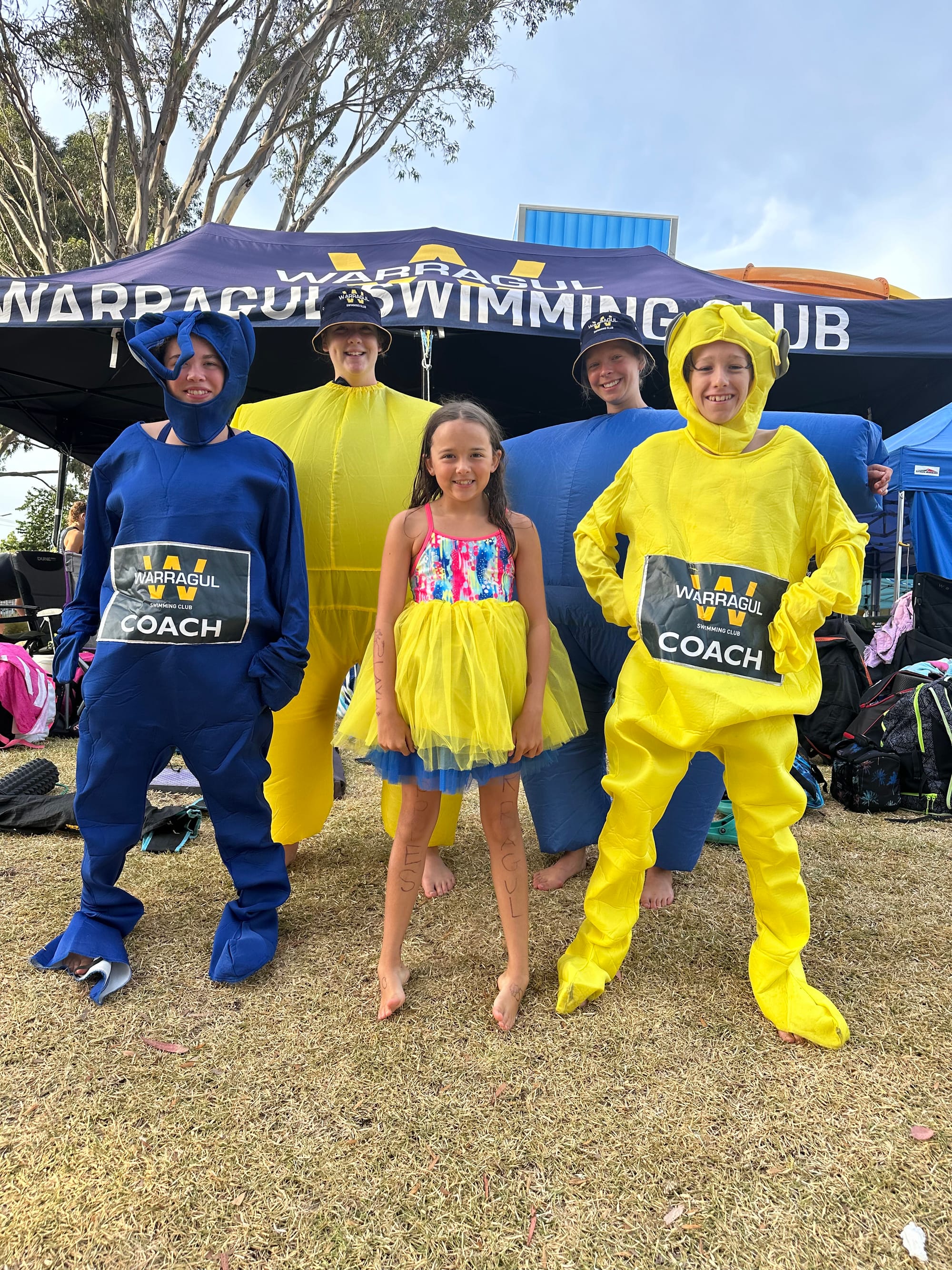 Proudly cheering when not swimming are Tyra Jensen, Charlotte Morland, Charlotte Sahhar, Ruby Logan and Joe McInerney.