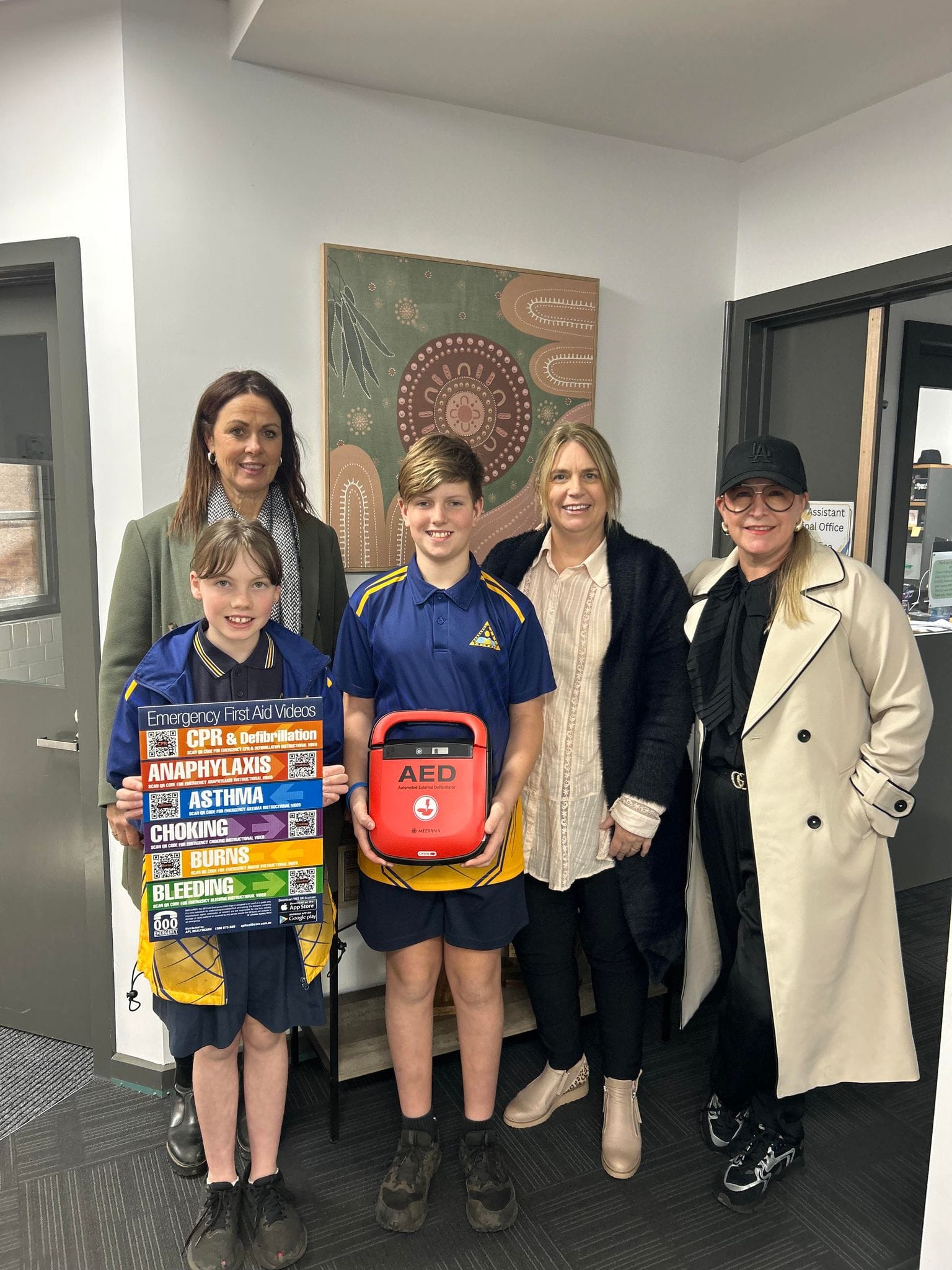 Margie Whitford, Charlytte, Madison, Olivia, Rudy, Tyson, Alfie and principal Michael Smethurst at Poowong Consolidated School.