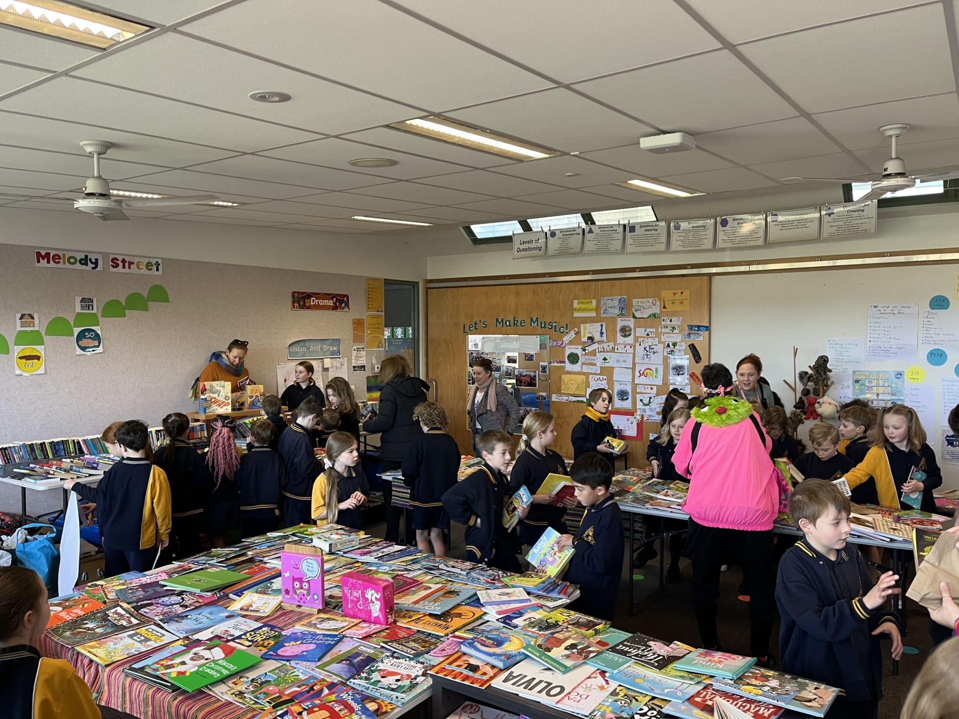 Melanie Turner (parent) and Ezzy at the book swap donation point